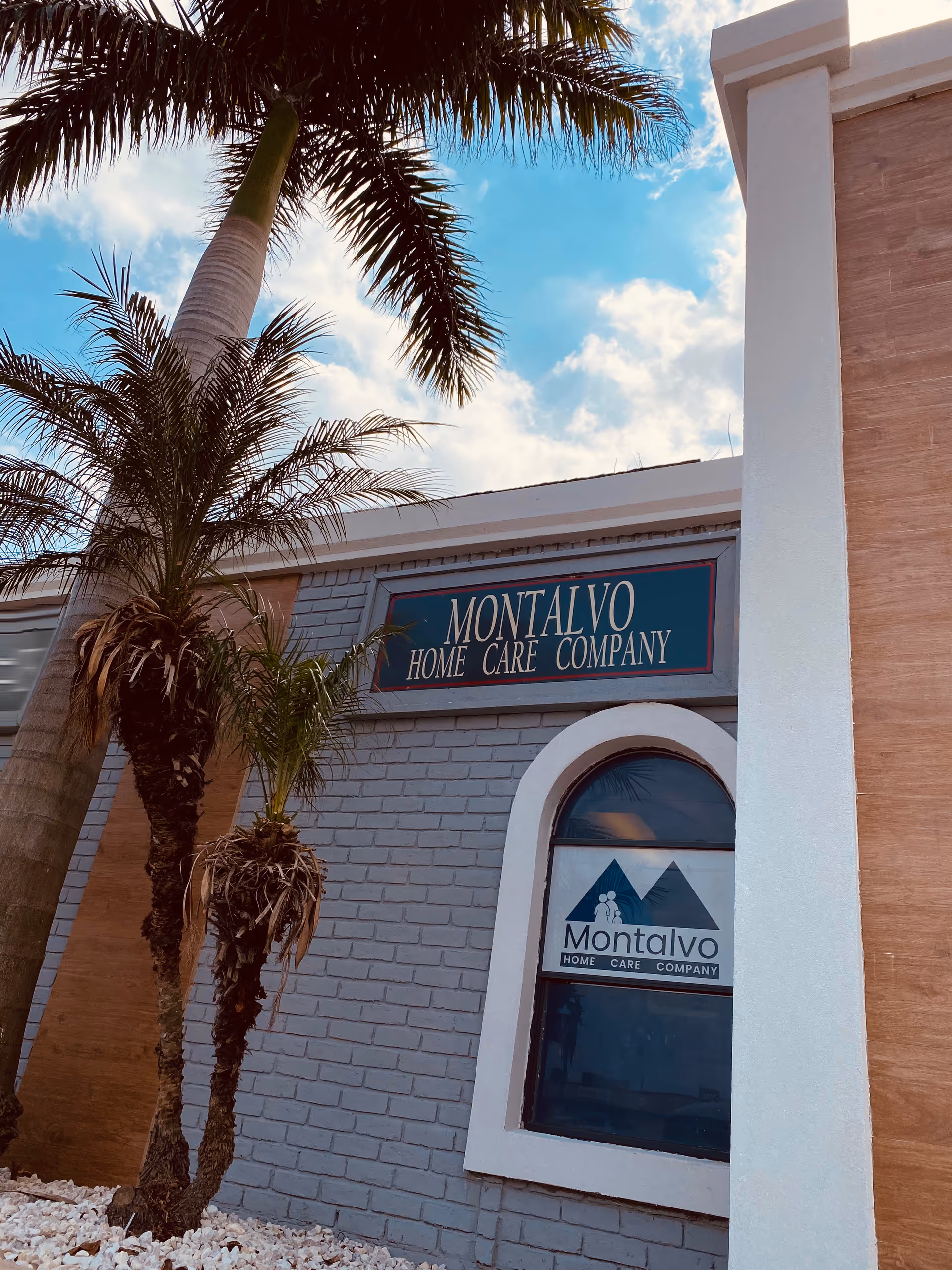 Exterior view of Montalvo Home Care Company building with palm trees.
