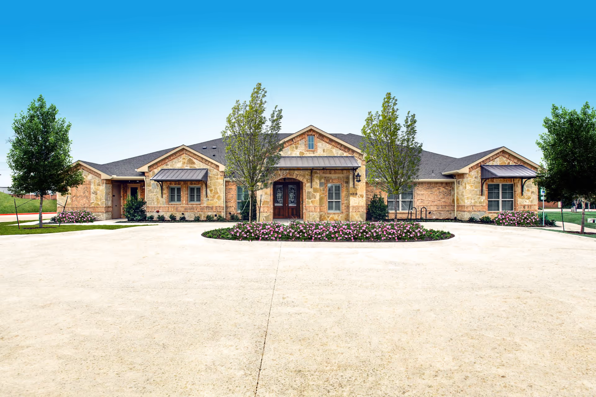 Exterior view of Avalon Memory Care - Keller II with a circular driveway.