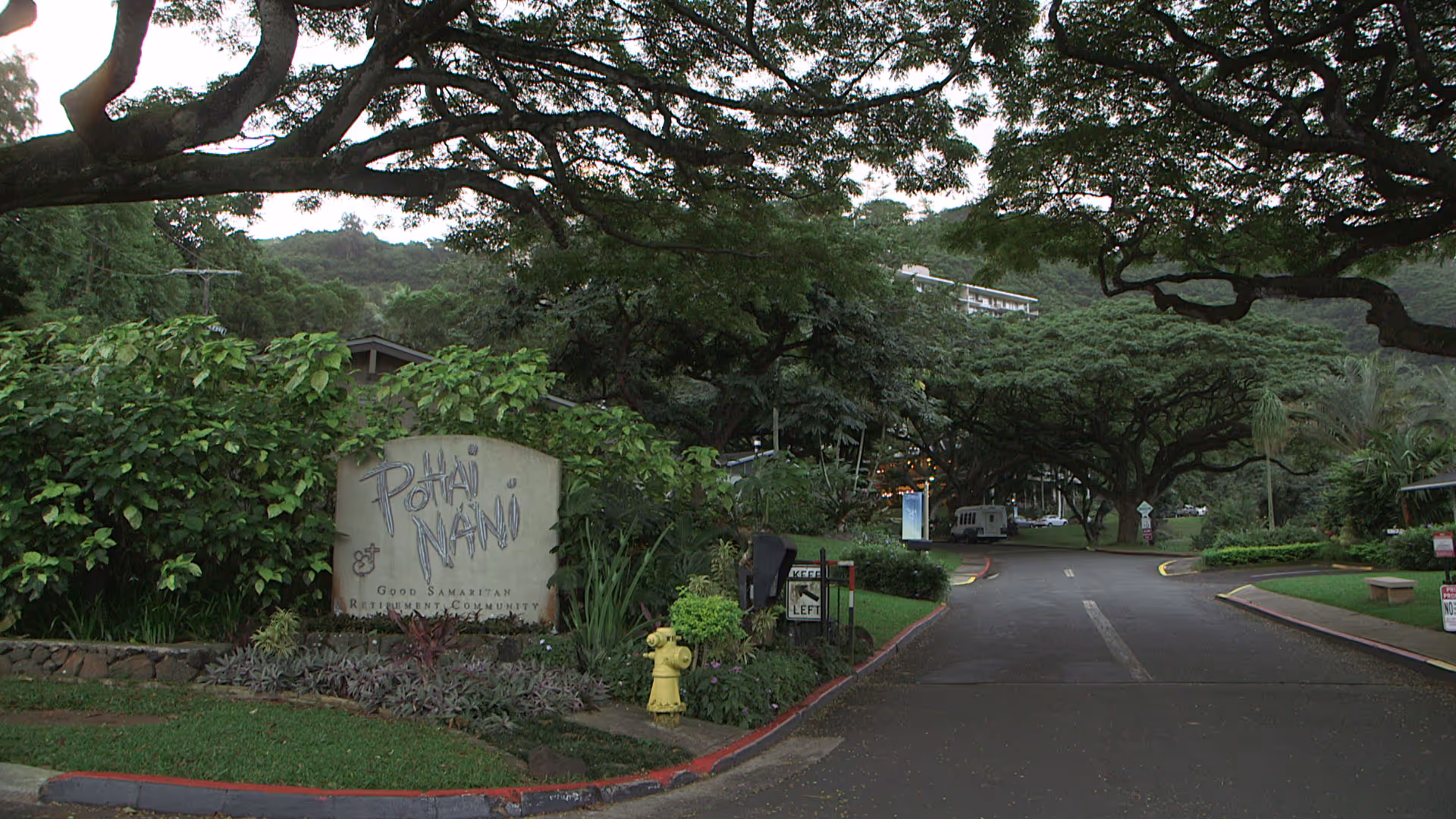 Entrance to Good Samaritan Society Pohai Nani with lush greenery and a driveway.