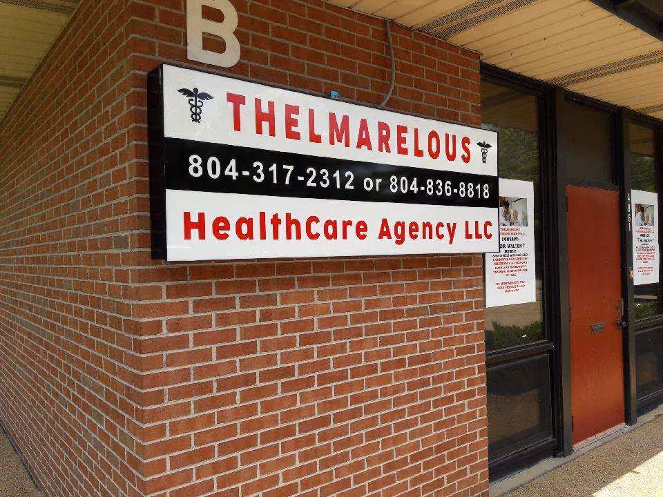 Exterior brick wall with a large sign reading Thelmarelous Healthcare Agency LLC and phone numbers.