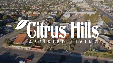 Aerial view of Citrus Hills Assisted Living facility with large logo overlay.