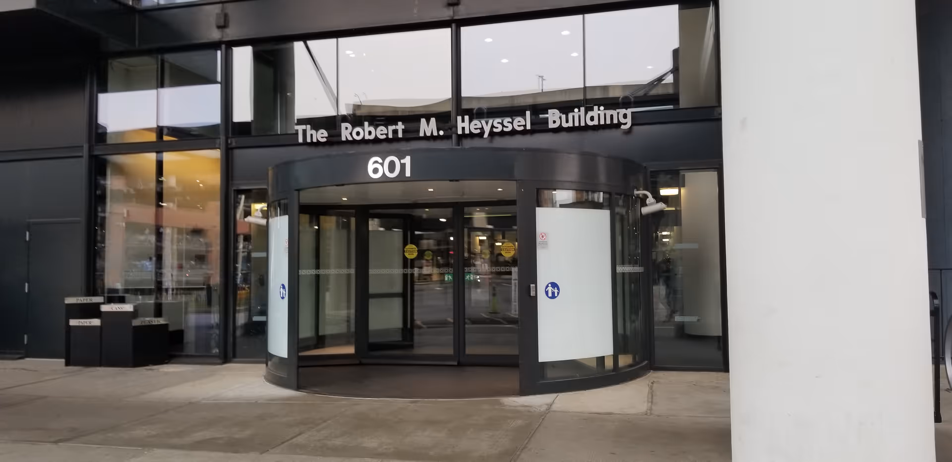 Entrance of The Robert M. Heyssel Building with revolving doors.