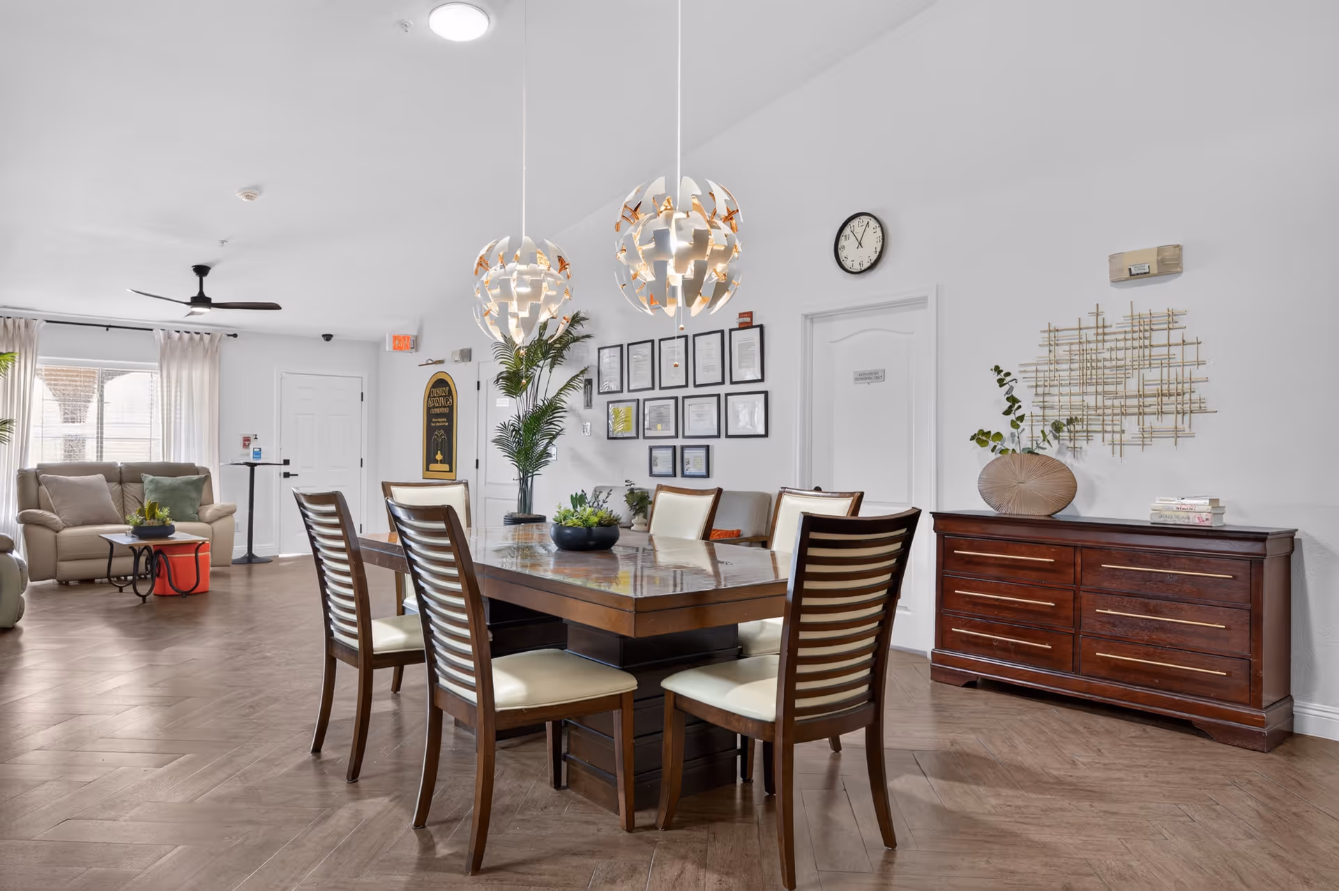 Bright dining room in a senior living facility with a large table and chairs.