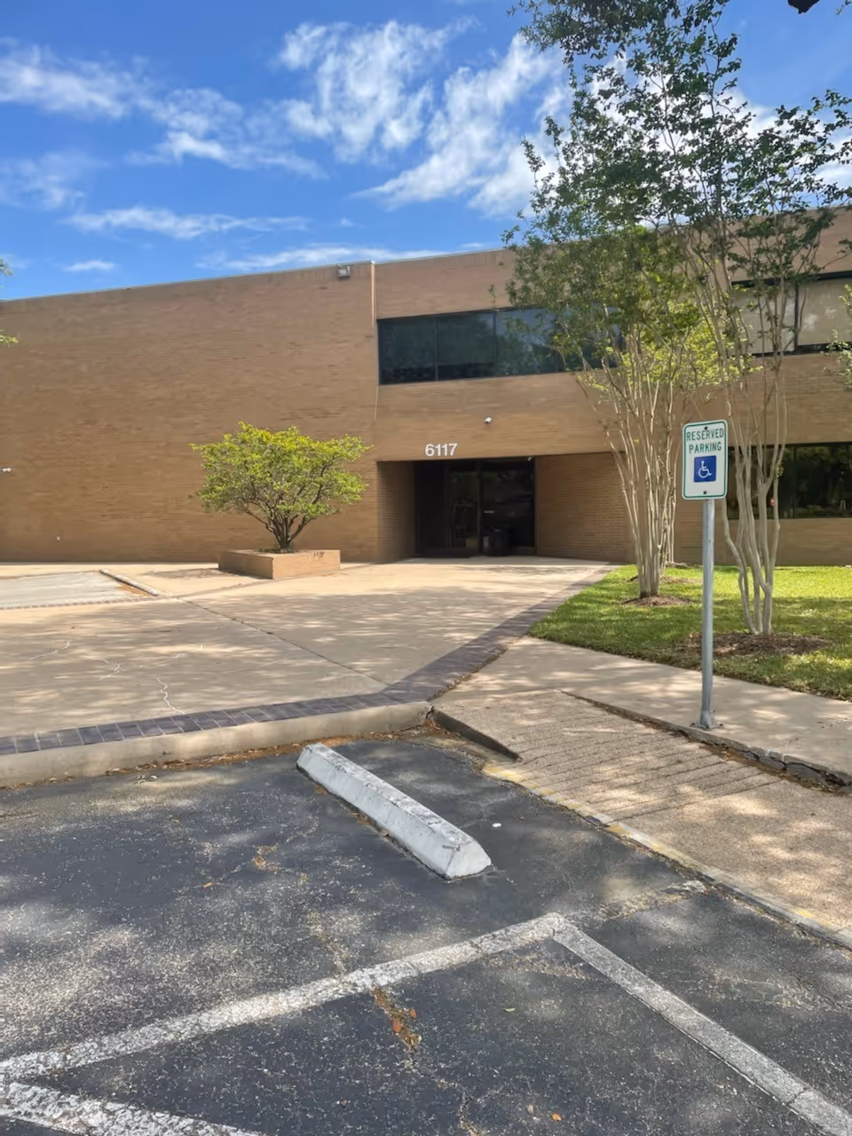 Exterior view of Comfort Keepers Houston building entrance with parking lot.