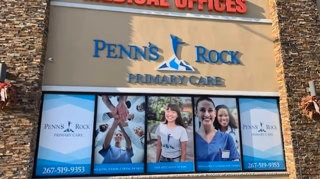 Front facade of Penn's Rock Primary Care with promotional window panels