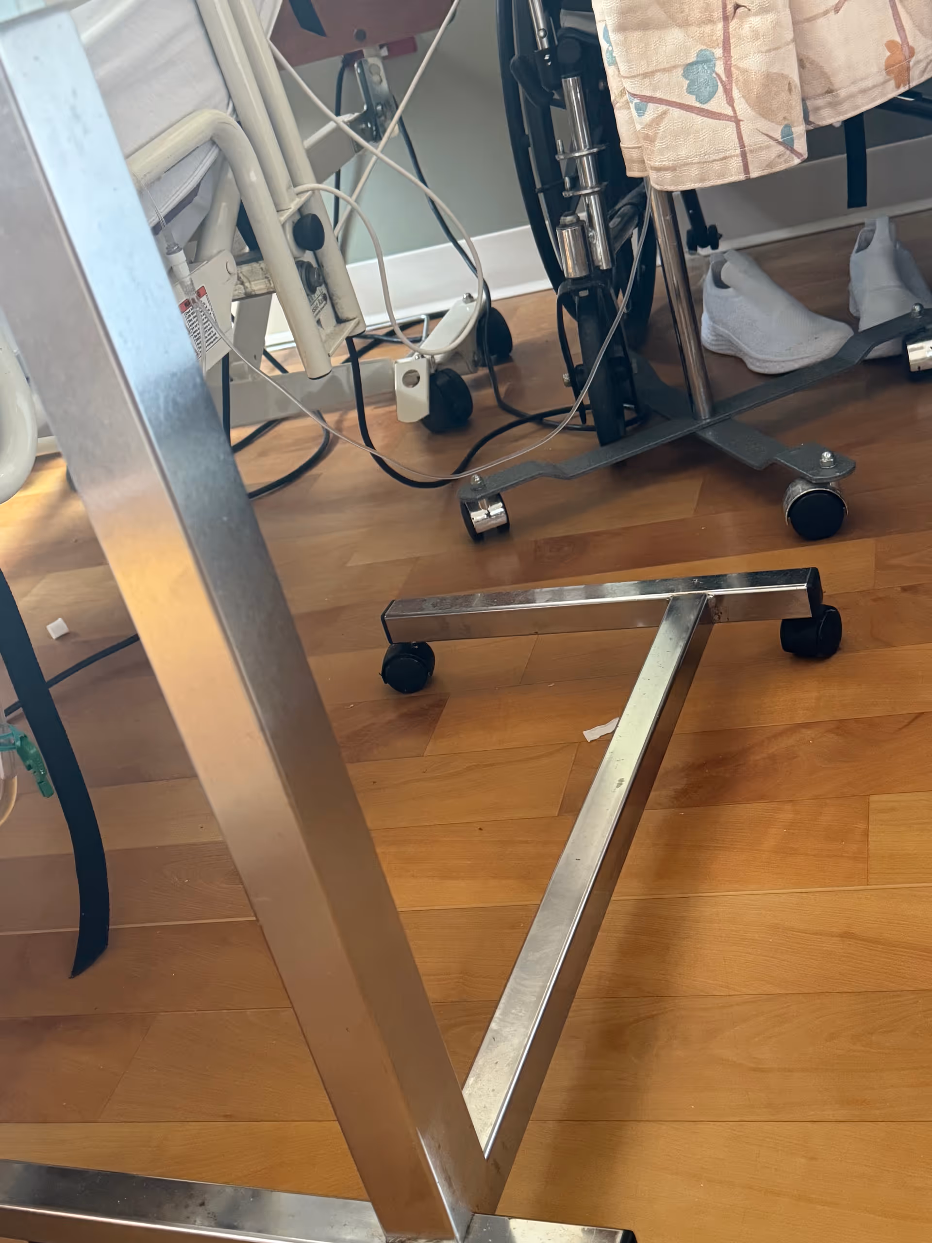 Bed frame and medical equipment in a patient room at Evergreen Health and Rehab.