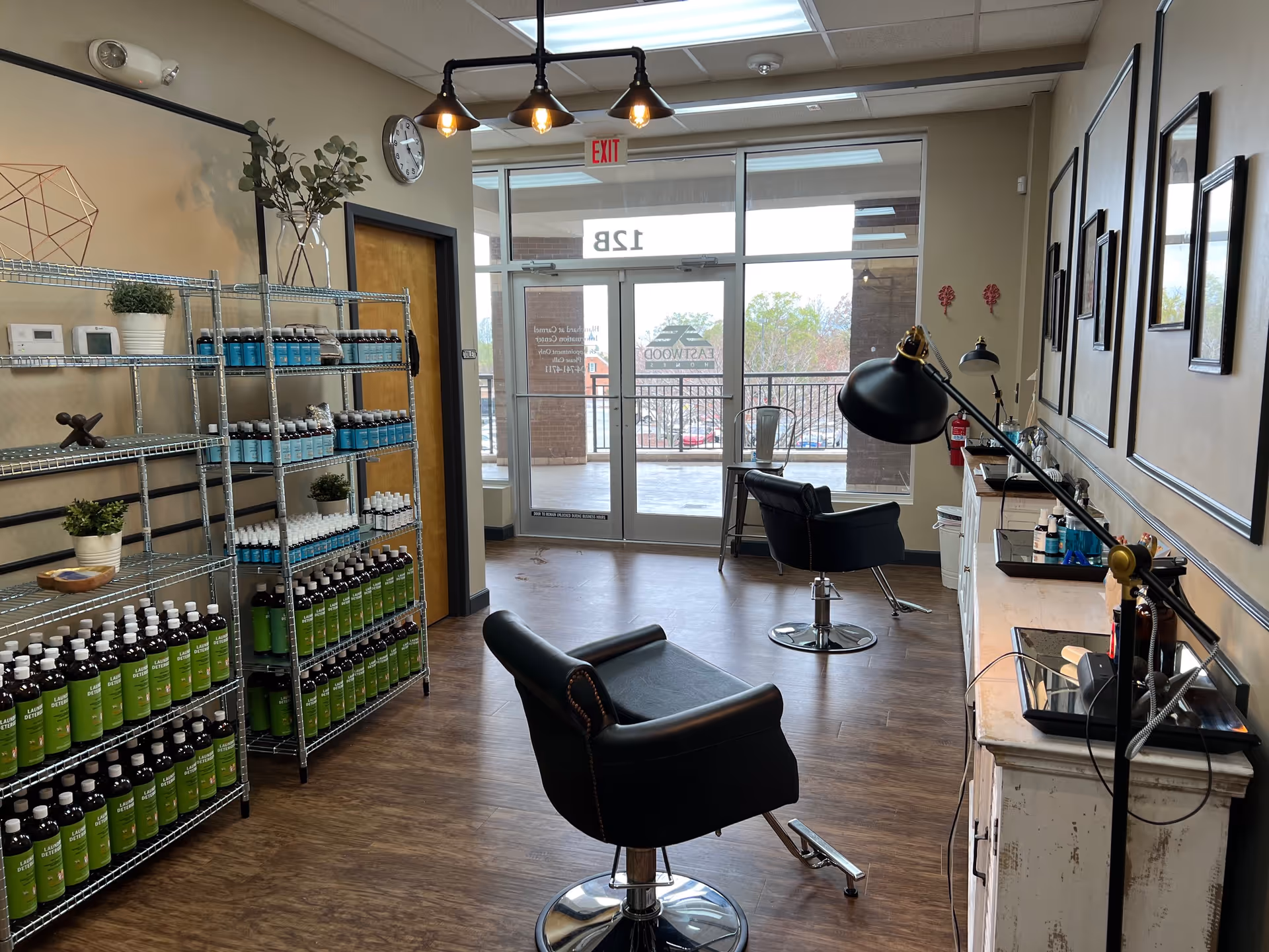 Hair salon area inside a senior facility with chairs, shelves, and a glass entrance.