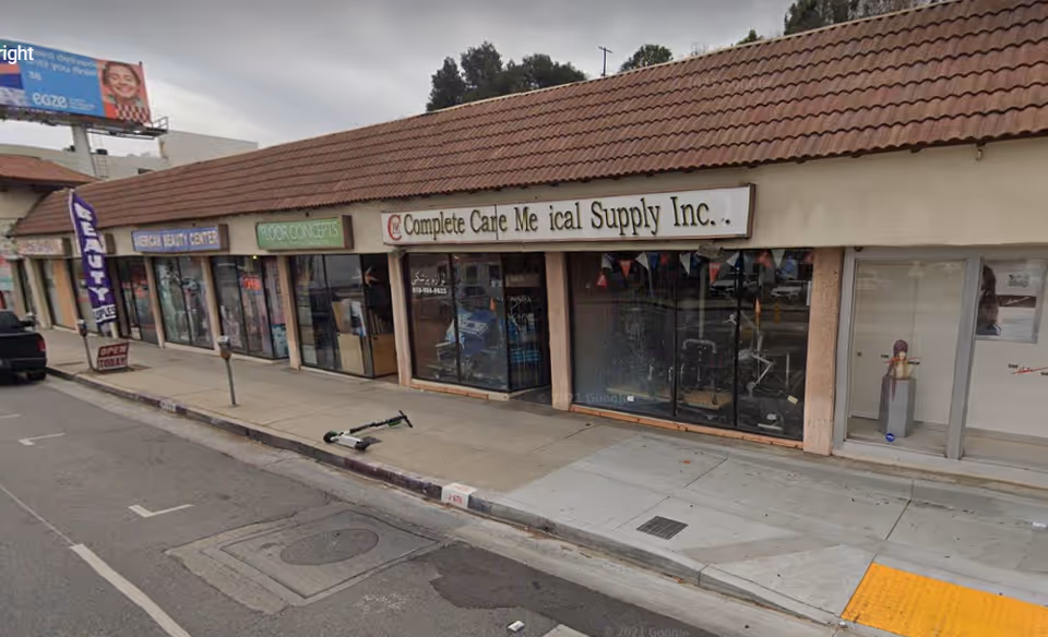 Exterior storefront row featuring Complete Care Medical Supply Inc. along a sidewalk.