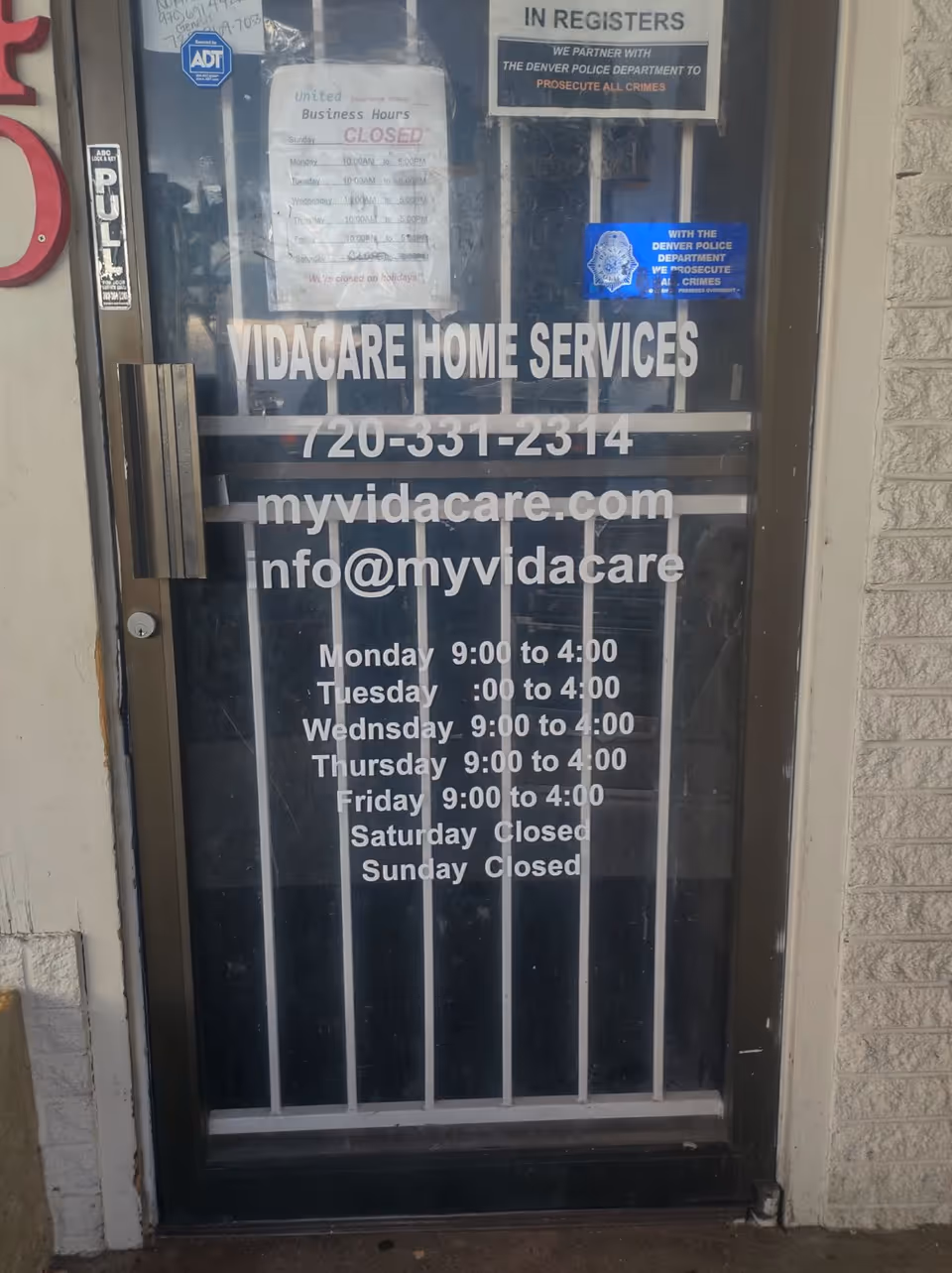Front door of VidaCare Home Services with business hours and contact details