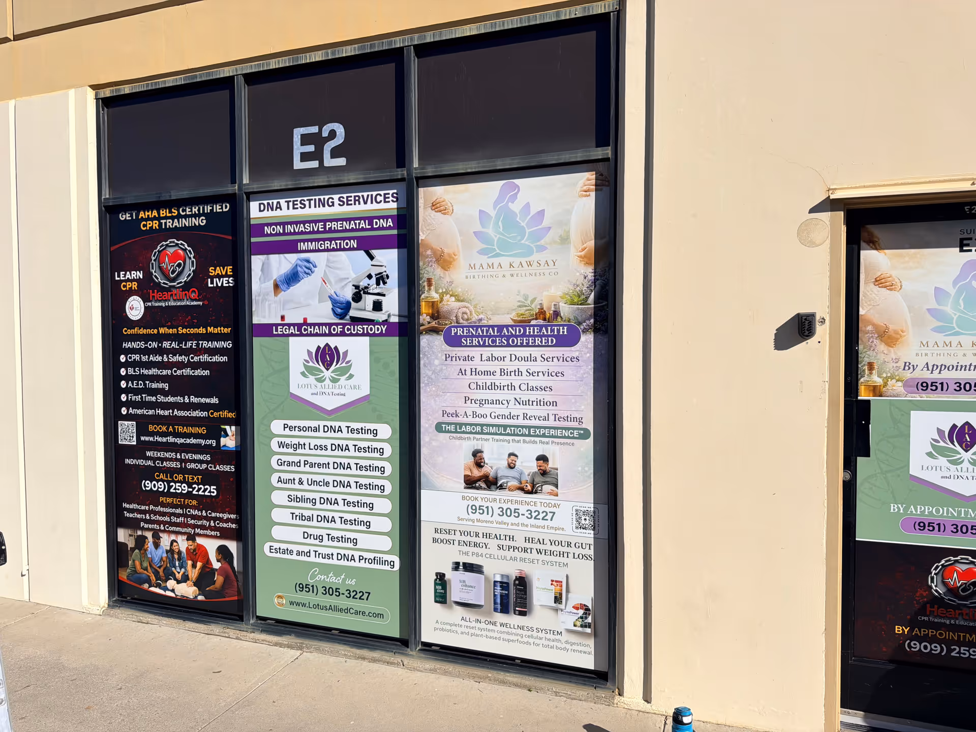 Exterior storefront advertising Lotus Allied Care and DNA Testing posters.