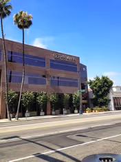 Three-story beige brick building labeled Specialty Surgical Center Beverly Hills along a sunny street