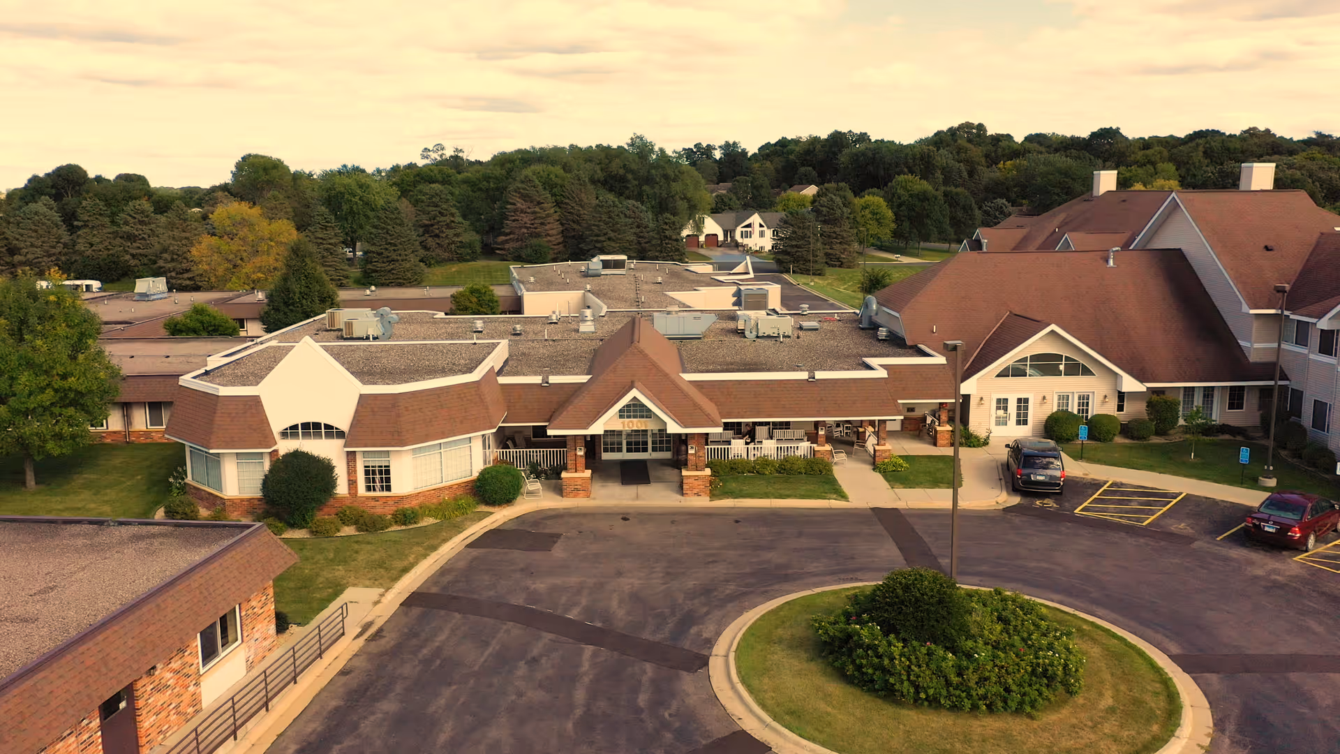 Aerial view of Mala Strana Care & Rehabilitation Center campus with parking and circular drive.