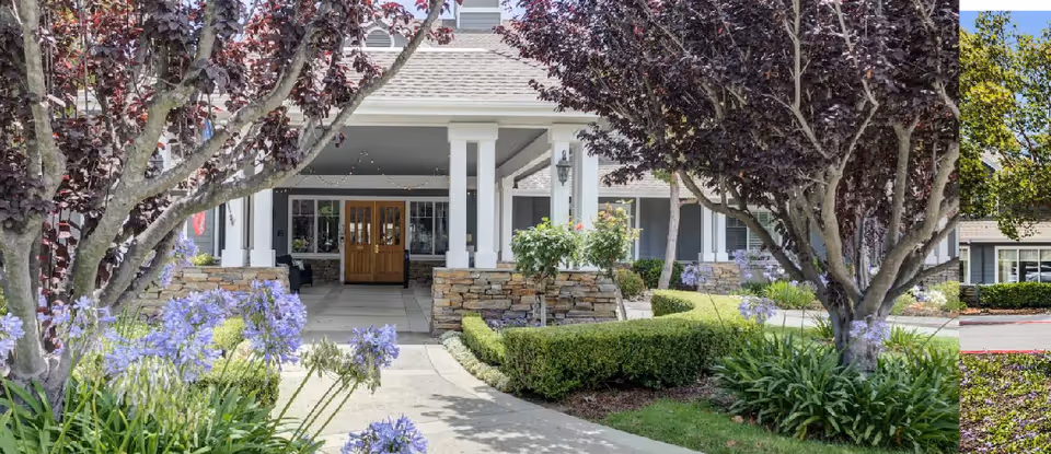 Entrance to Eastwood Cottage I with a covered porch and landscaped grounds.