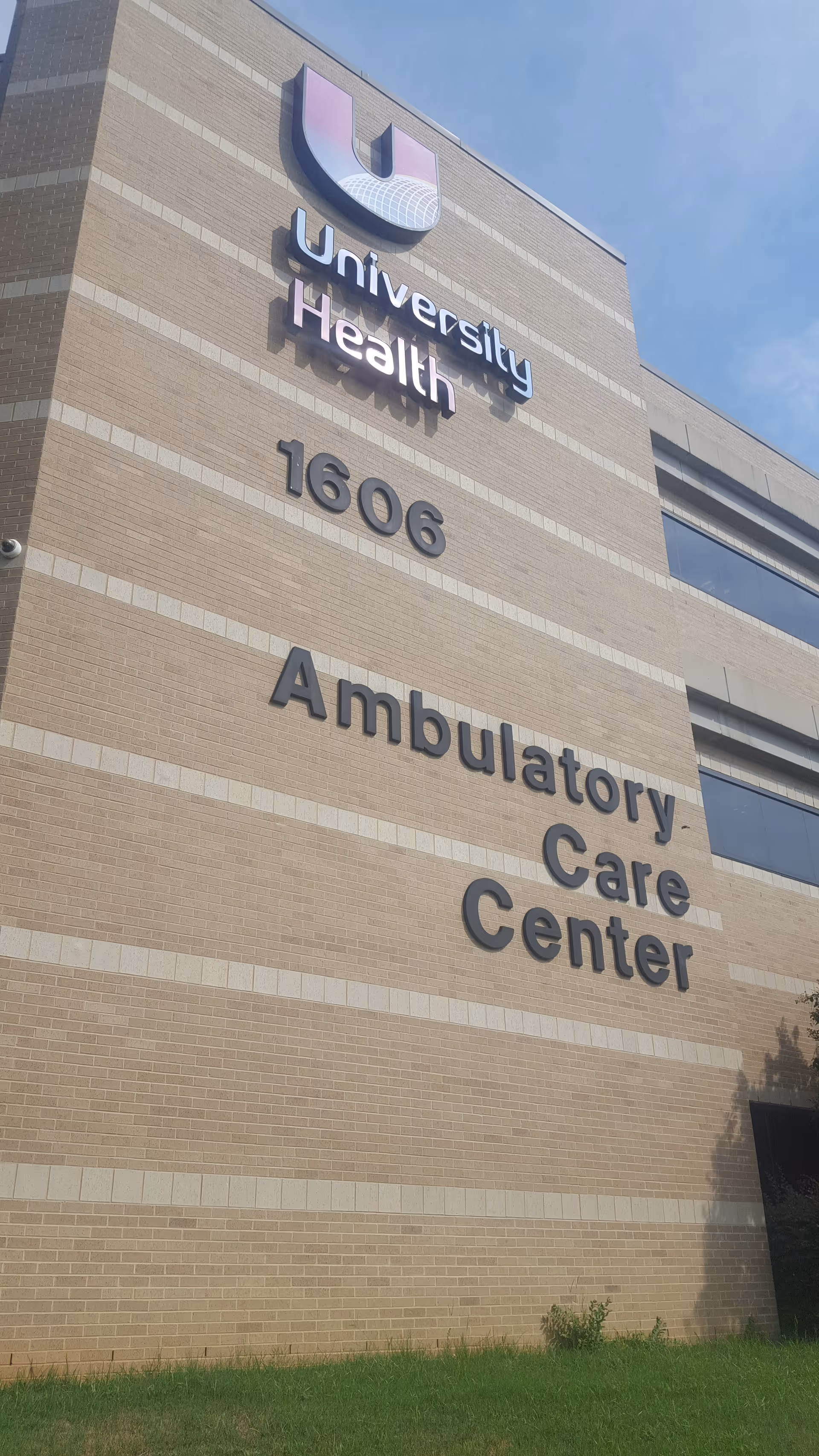 Brick building front with University Health Ambulatory Care Center sign and 1606