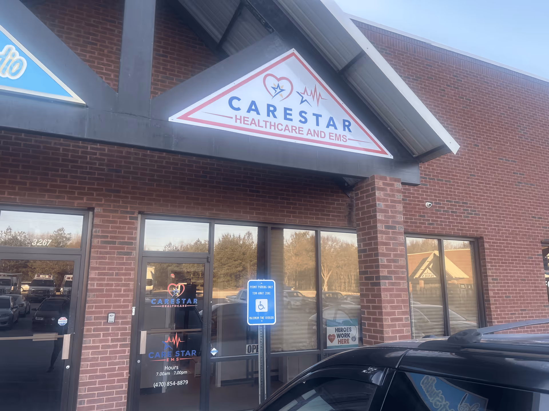 Exterior view of Care Star Healthcare storefront with brick facade and glass entrance doors.