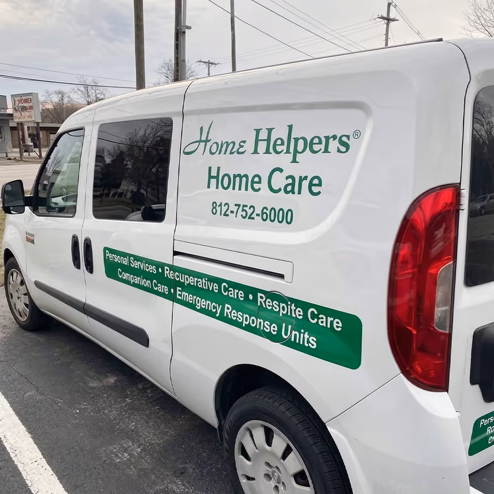 White van with Home Helpers Home Care Evansville branding parked outdoors.