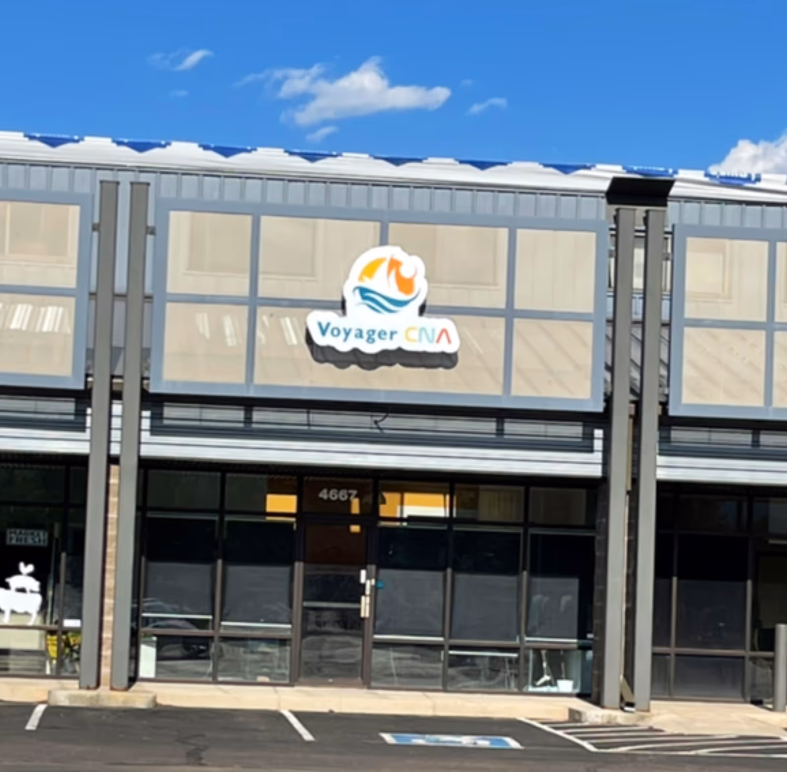 Exterior view of a building with a Voyager CNA sign on the facade.