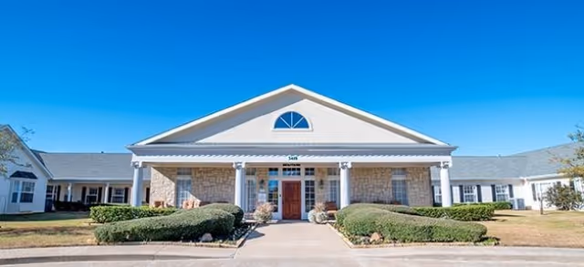 Front view of Brookdale Willows Sherman senior living facility with stone facade and columns.