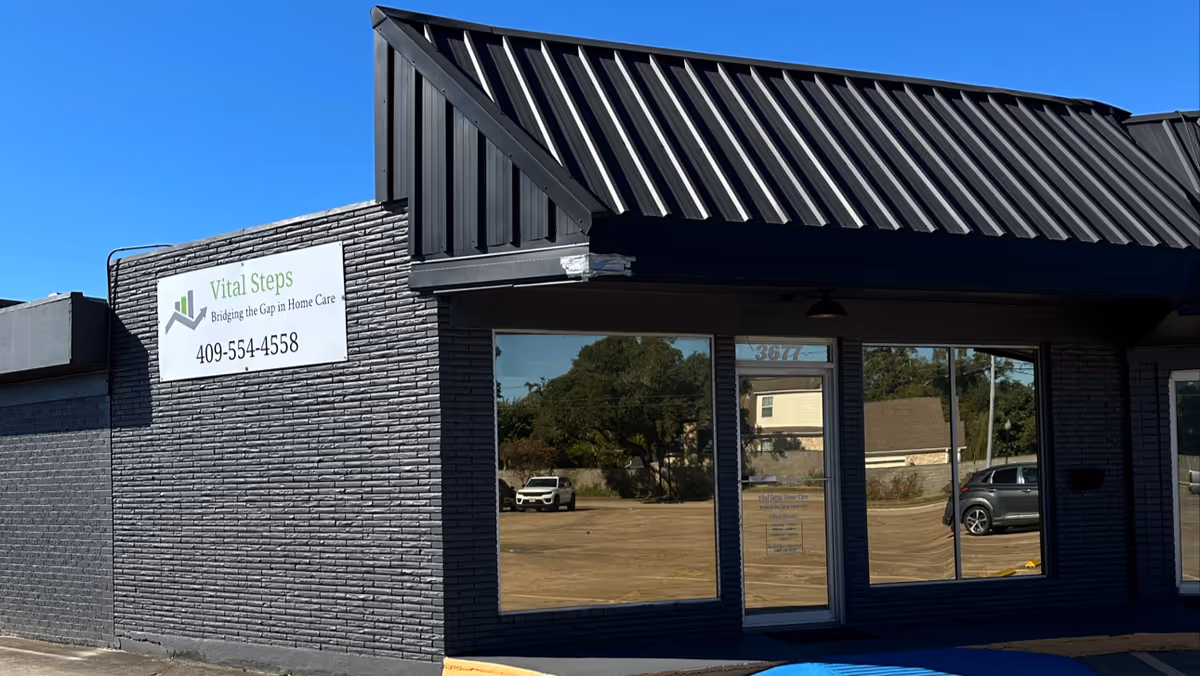 Exterior view of Vital Steps Home Care building with sign and glass doors