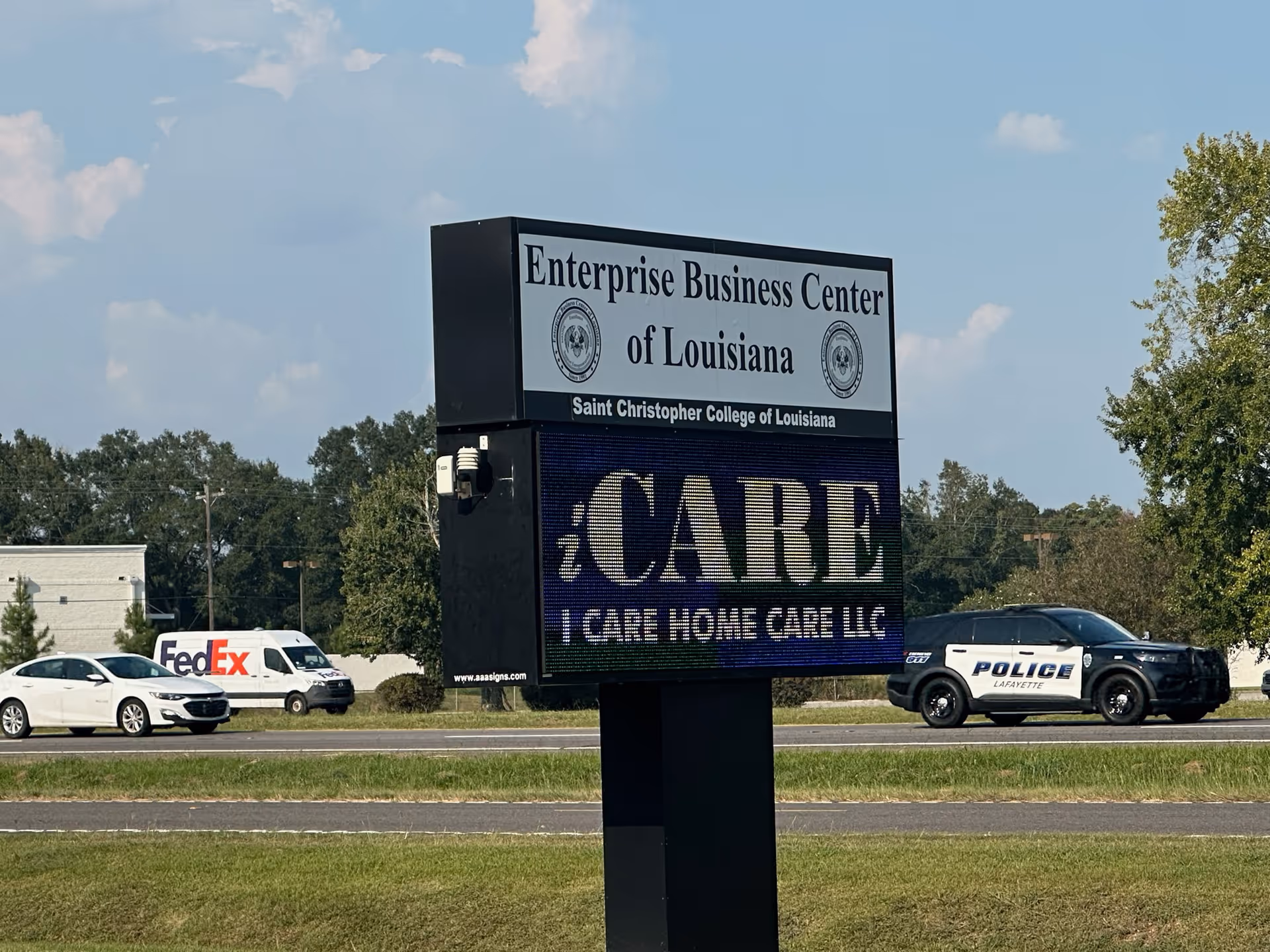 A large outdoor sign advertising I Care Home Care LLC along a road.