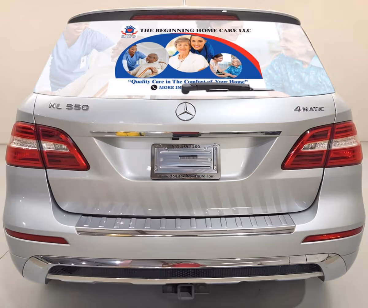 Rear view of a silver SUV with The Beginning Home Care decal on the rear window