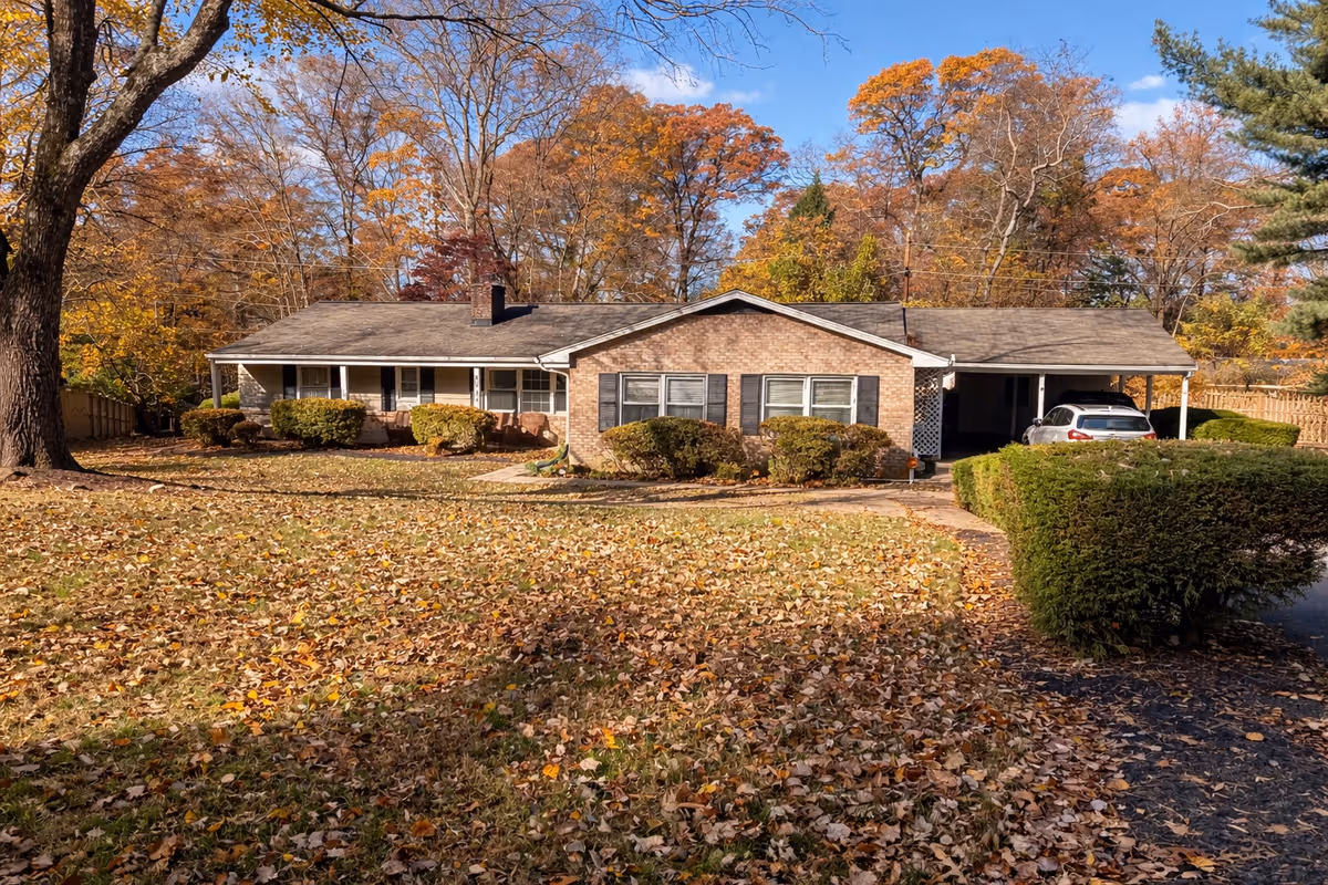 Ashleigh's Place is a single-story brick senior living facility with a carport.