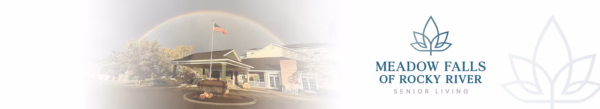 Exterior view of Meadow Falls of Rocky River Senior Living entrance with flag and driveway.