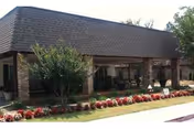 Exterior of Mobile Nursing and Rehabilitation, LLC, with brick front and landscaped walkway.