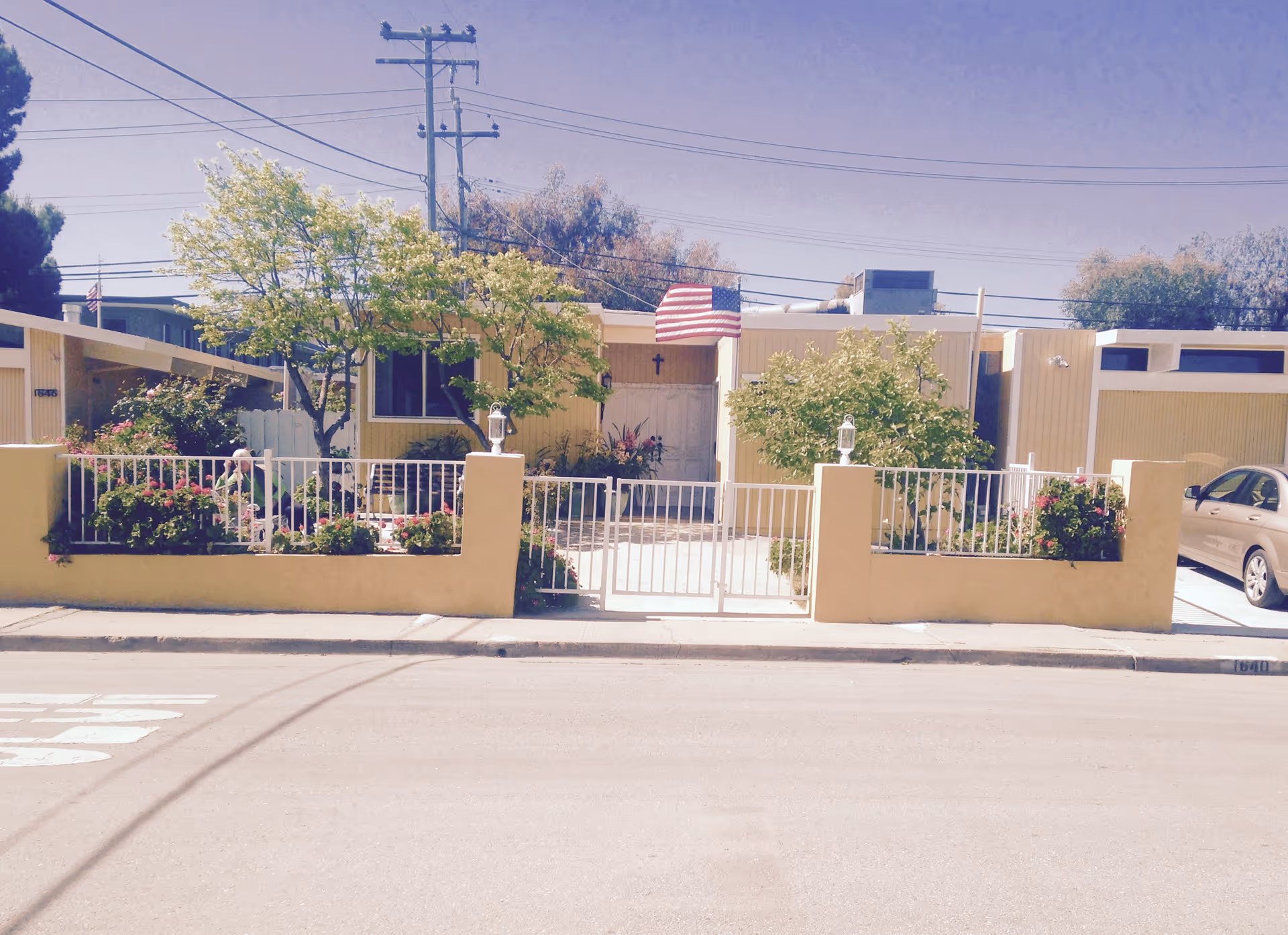 Exterior view of Vanessa Care Home II, a single-story senior residence with a gated entrance.