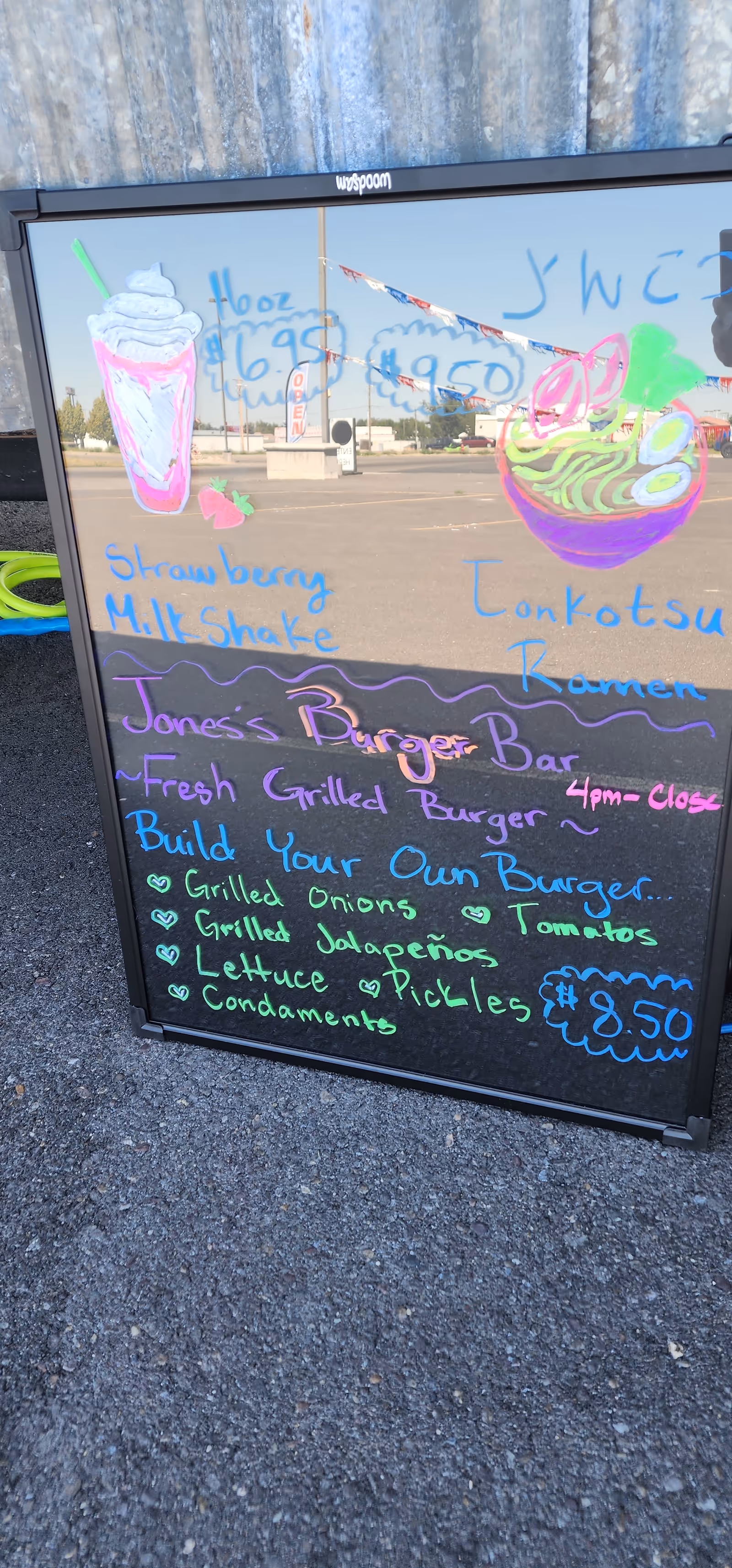 Outdoor chalkboard menu sign outside a senior living facility with colorful food drawings.