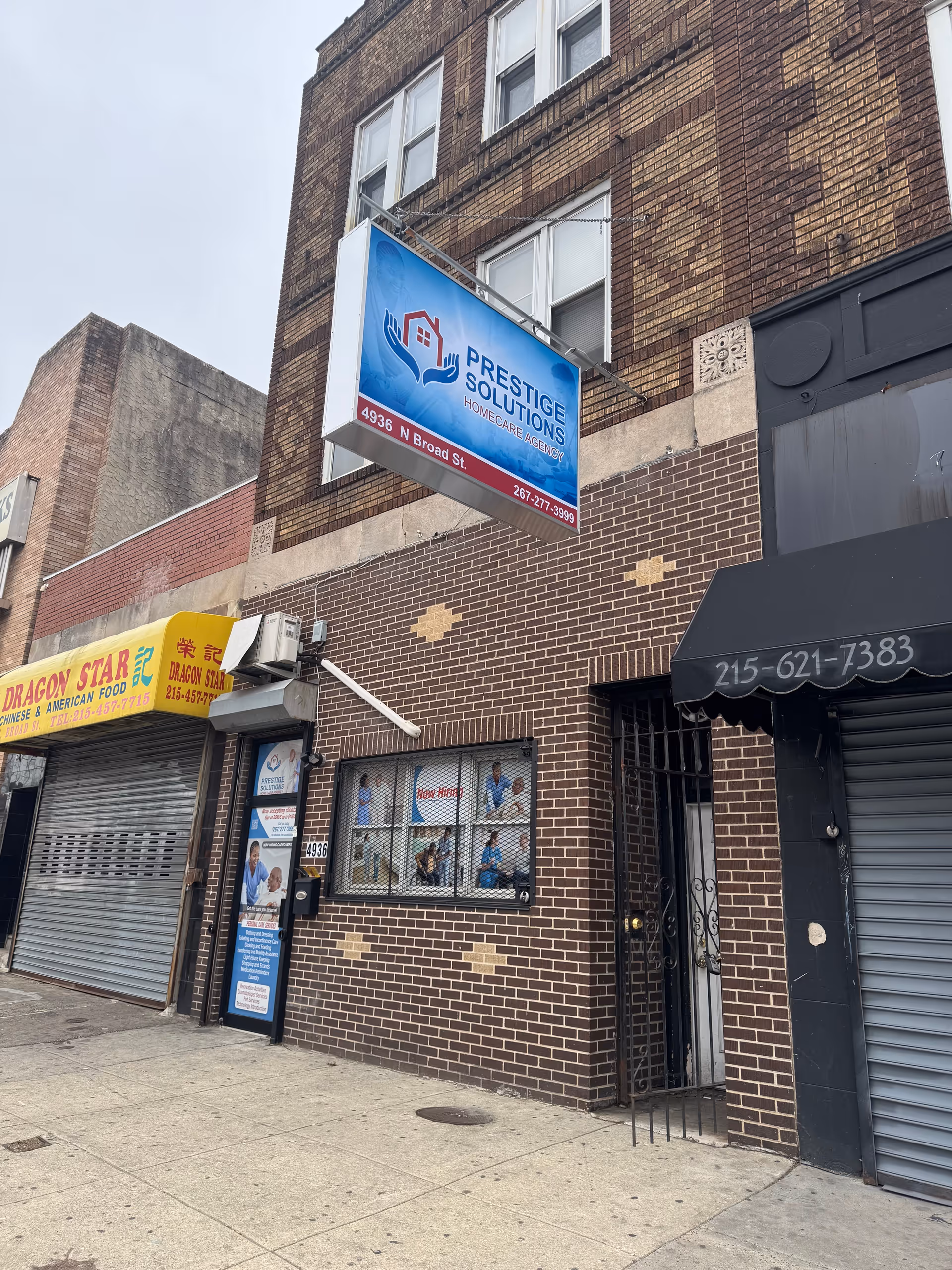 Brick building with a blue Prestige Solutions HomeCare Agency storefront sign.