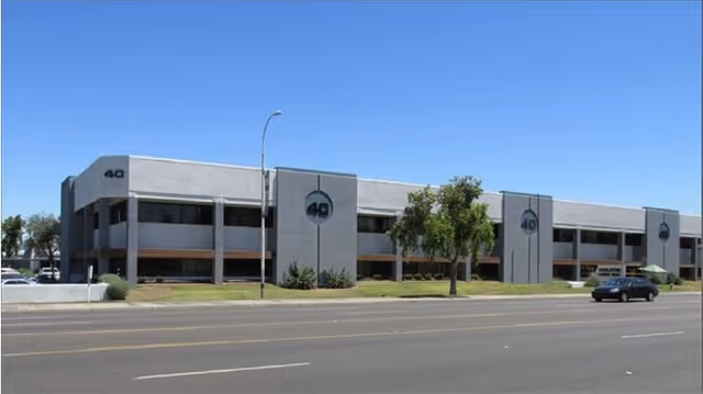 Exterior view of Desert Rose Compassionate Care building along a street