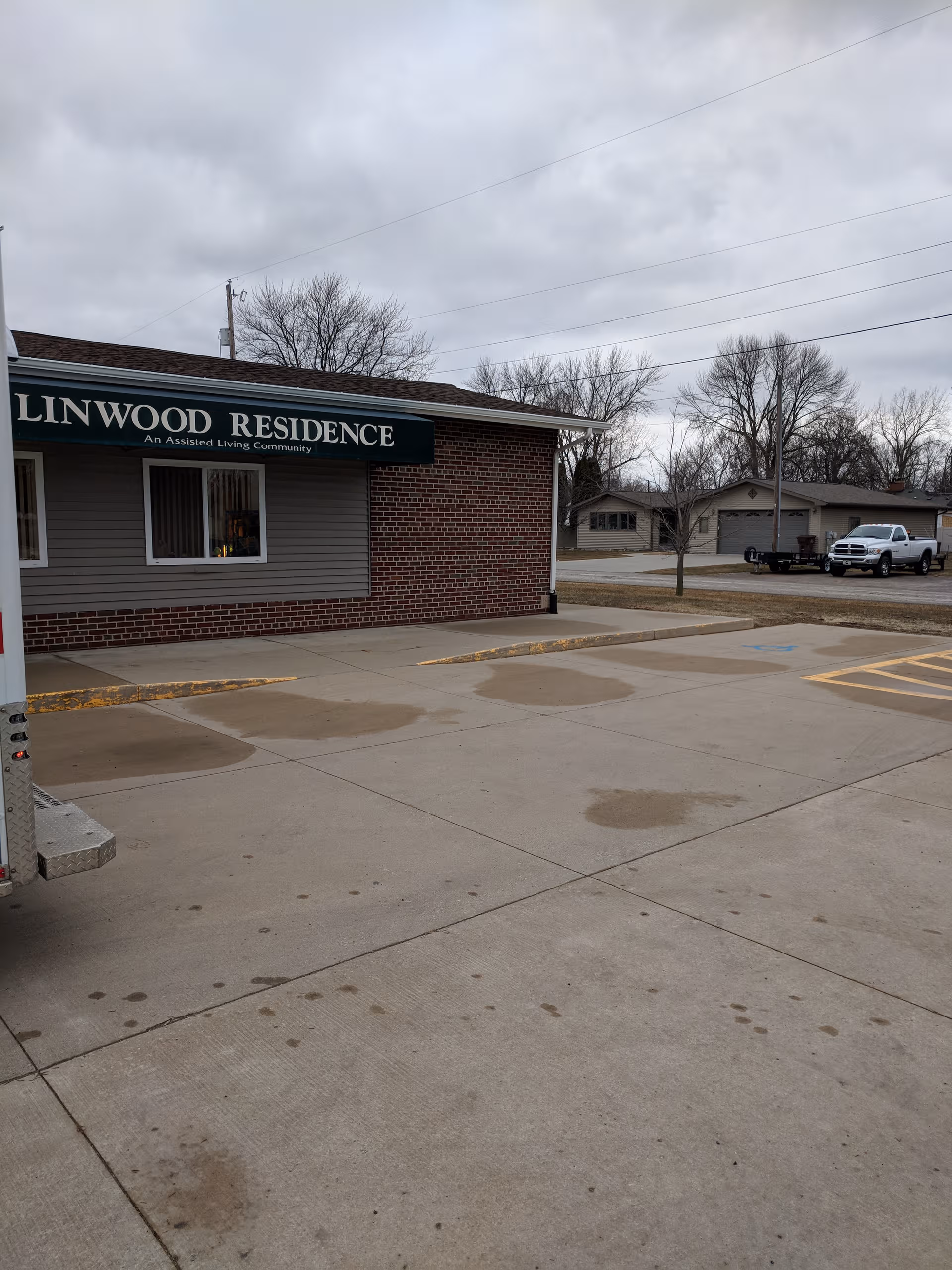 Exterior view of Linwood Residence building with sign and surrounding parking lot