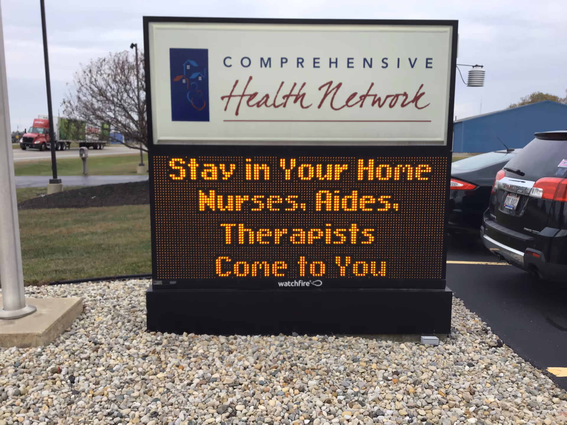 Exterior sign for Comprehensive Health Network with a digital message board.