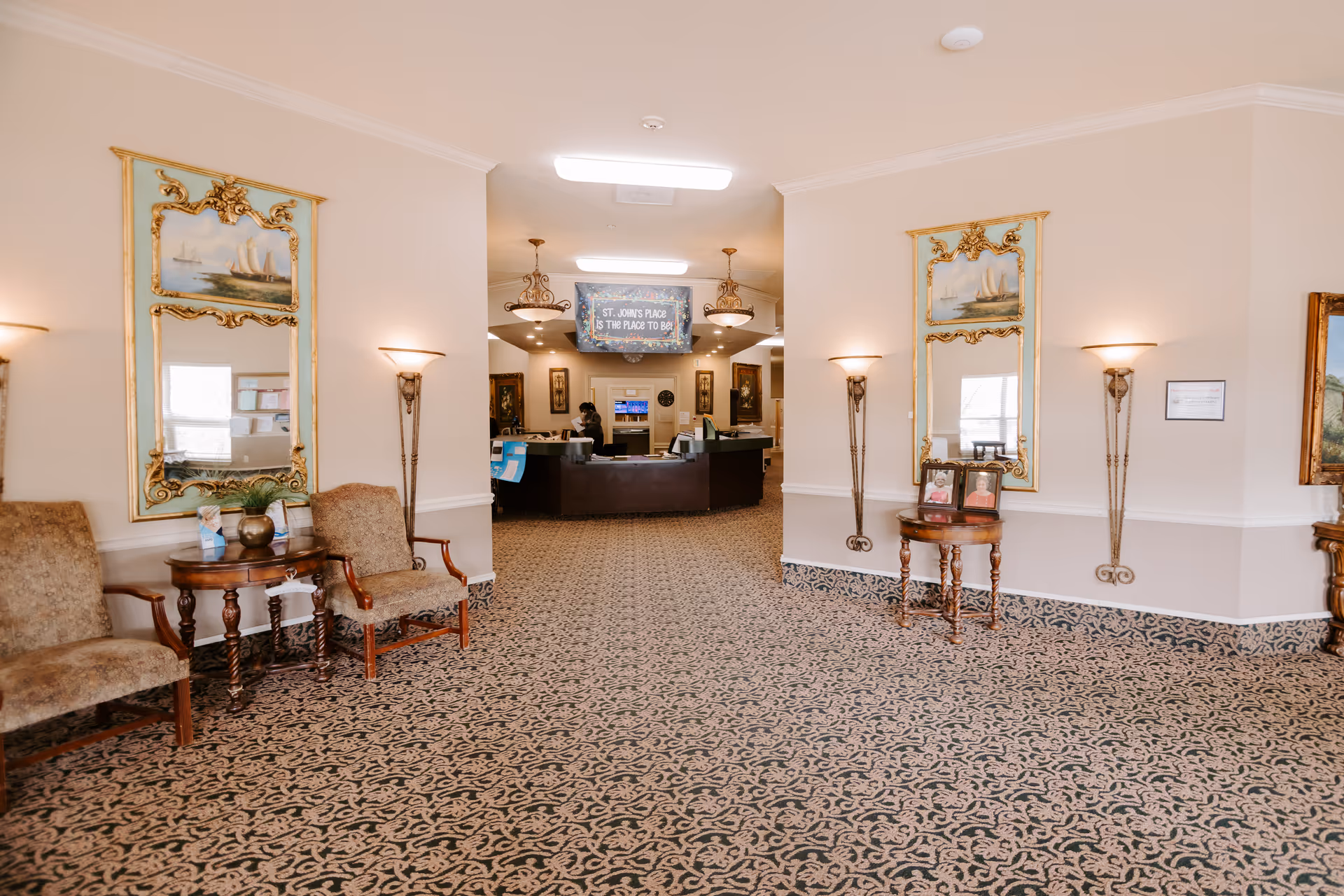 Lobby of St Johns Place of Arkansas with seating and a reception desk.