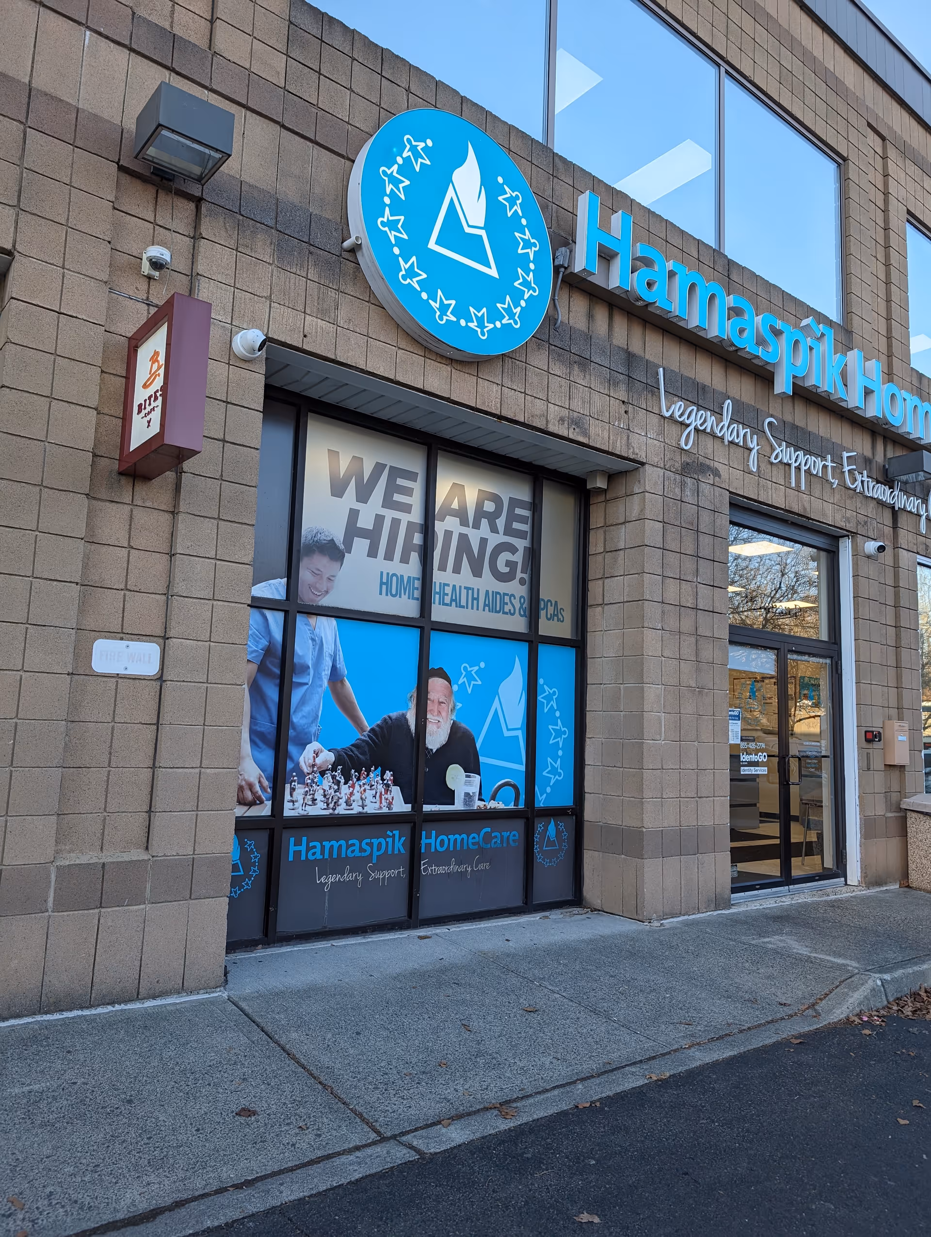 Exterior view of Hamaspik HomeCare building with blue sign and entrance.