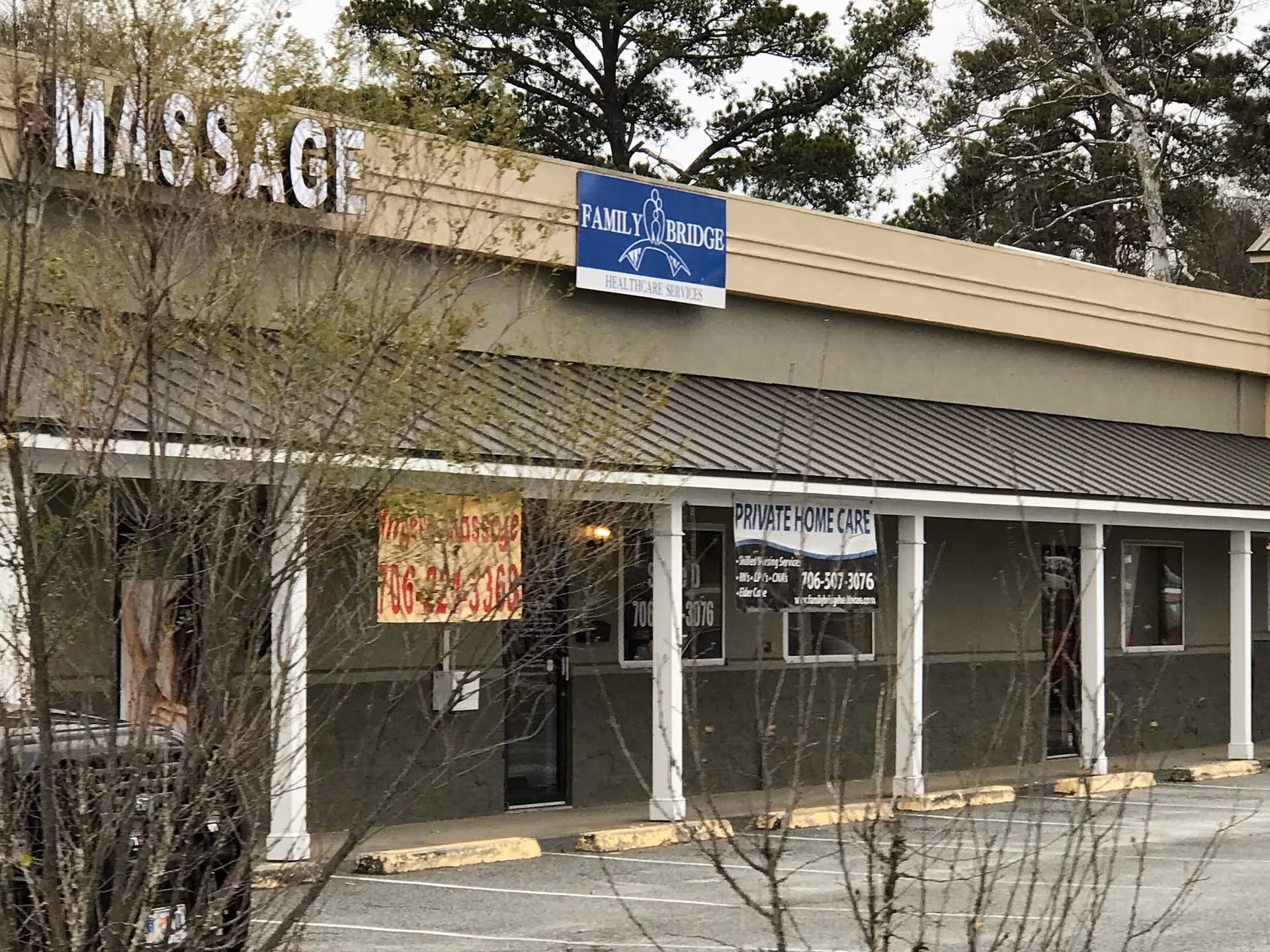 Exterior storefront of a healthcare facility with a Family Bridge sign and private home care banner.