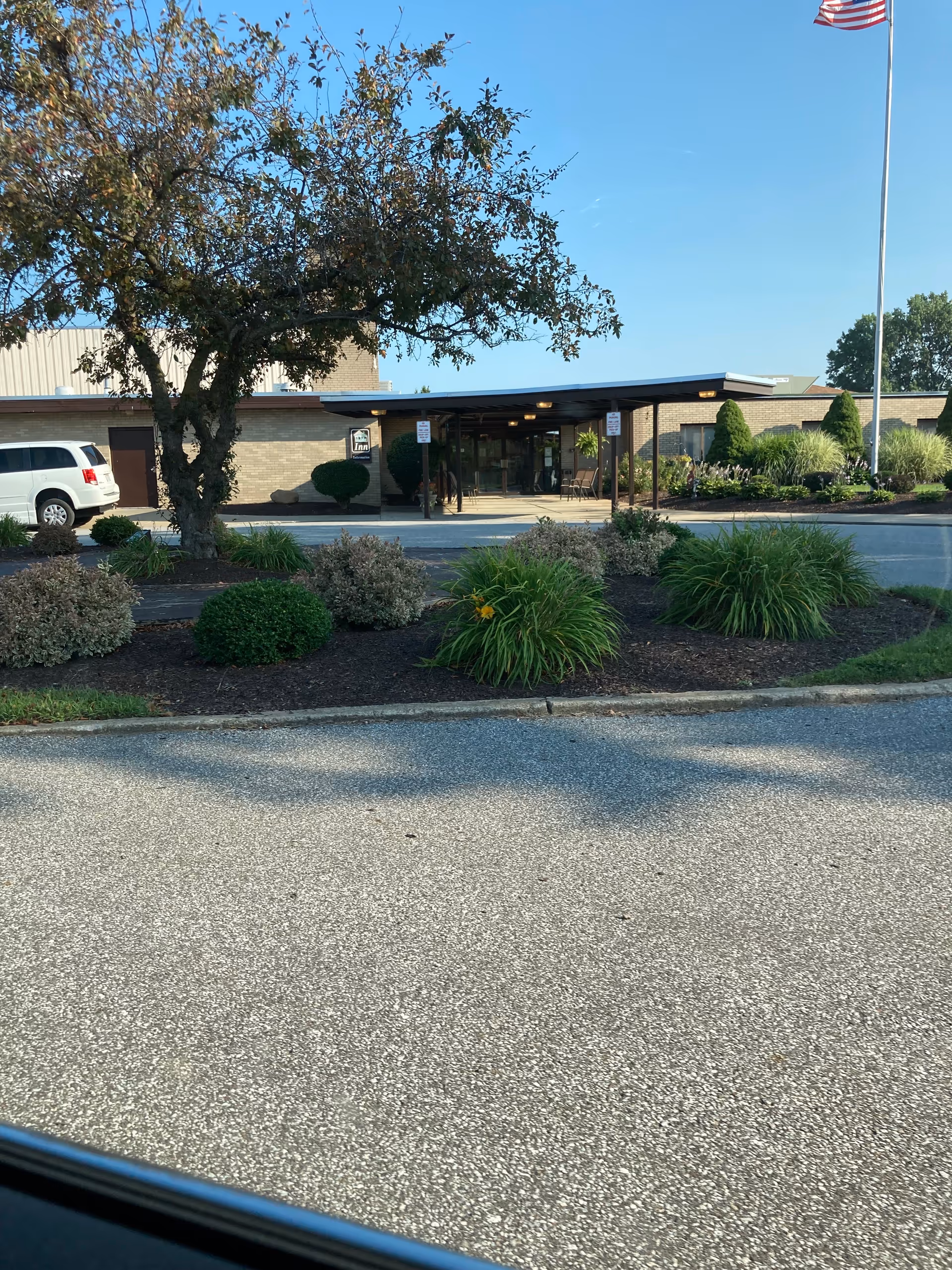 Entrance to North Park Care Center with a covered drop-off area and landscaped surroundings.