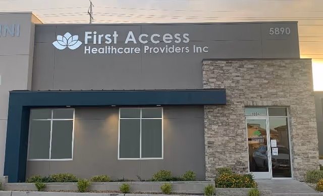 Exterior view of a First Access Healthcare Providers, Inc. building with glass entrance door.