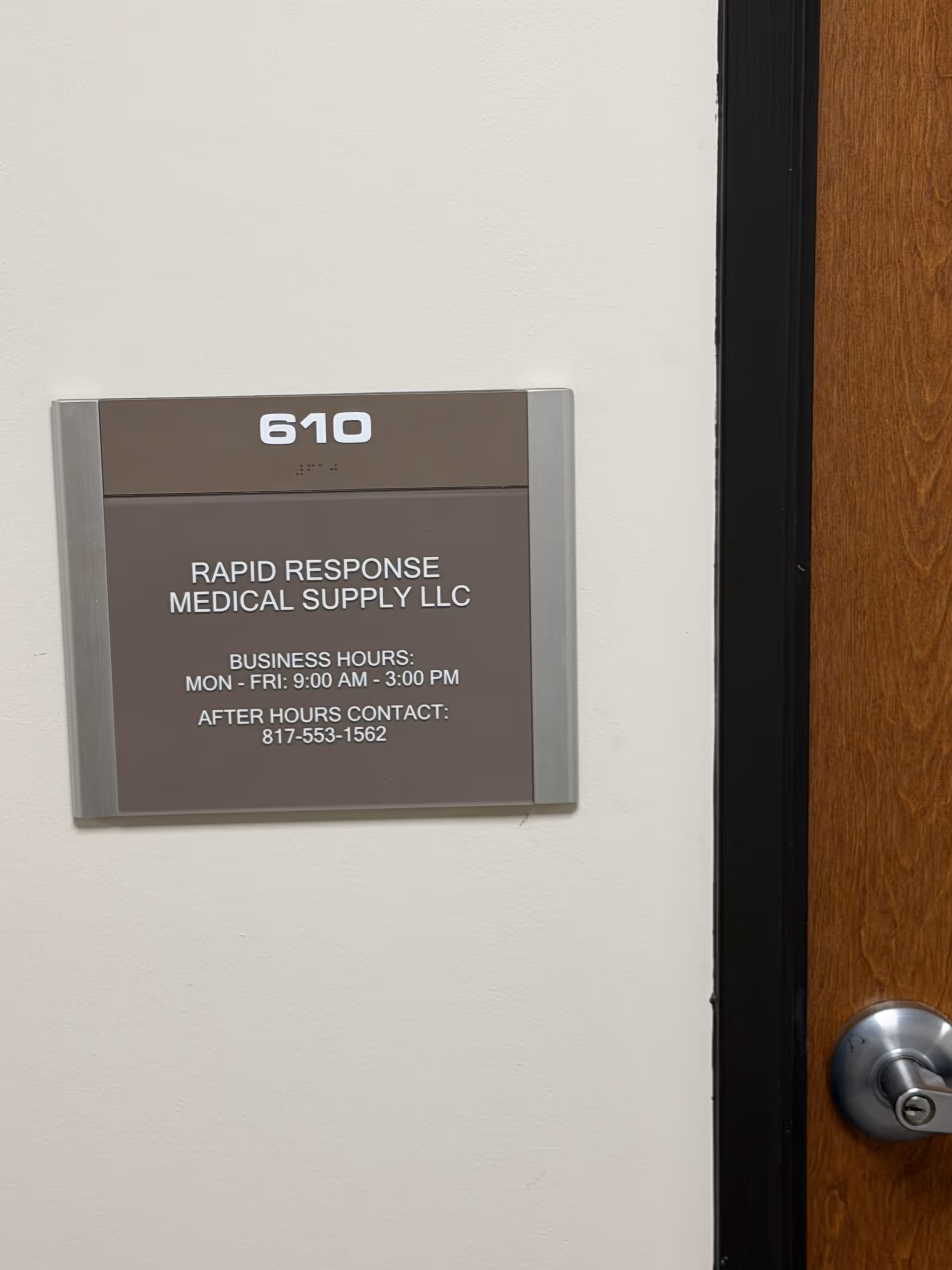 Interior wall plaque shows unit 610 and Rapid Response Medical Supply LLC hours.