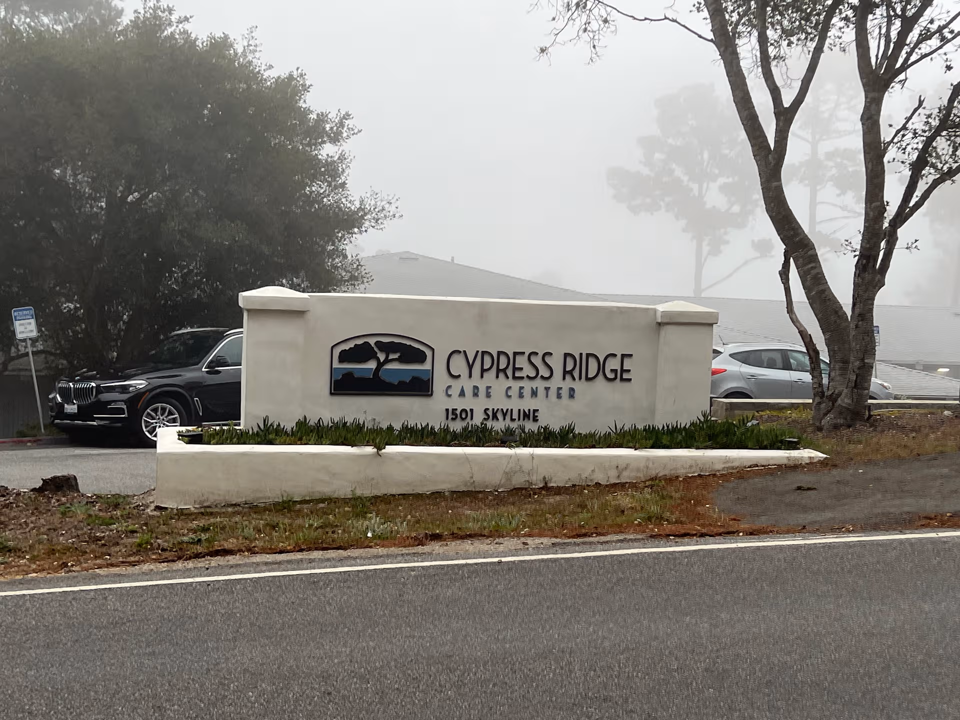 Sign for Cypress Ridge Care Center on a landscaped exterior entrance