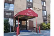 Front entrance of Sea Crest Nursing and Rehabilitation with a red canopy.
