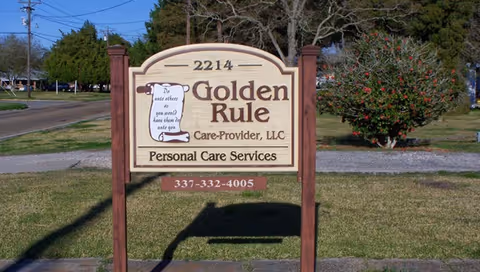Exterior wooden sign for Golden Rule Care-Provider, LLC, Personal Care Services.