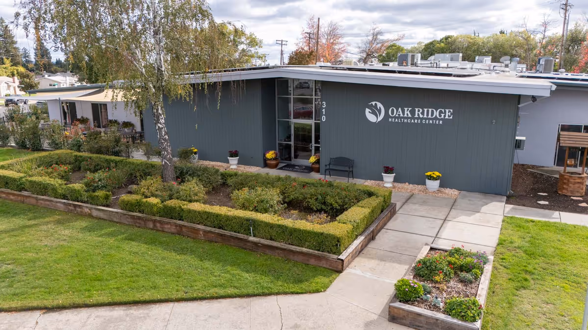 Exterior view of Oak Ridge Healthcare Center front entrance with landscaped yard.