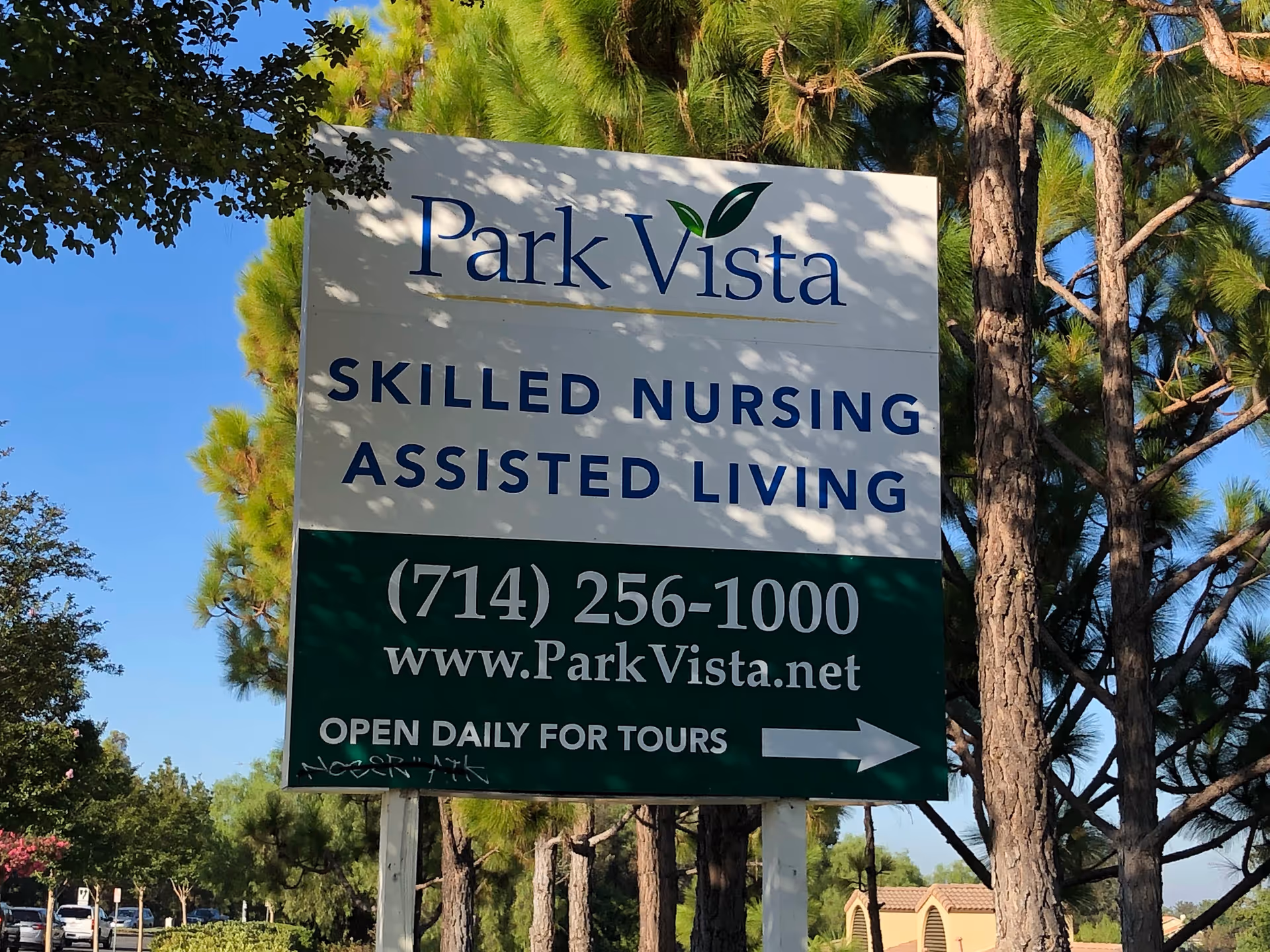Park Vista sign advertising skilled nursing and assisted living with contact info outdoors.