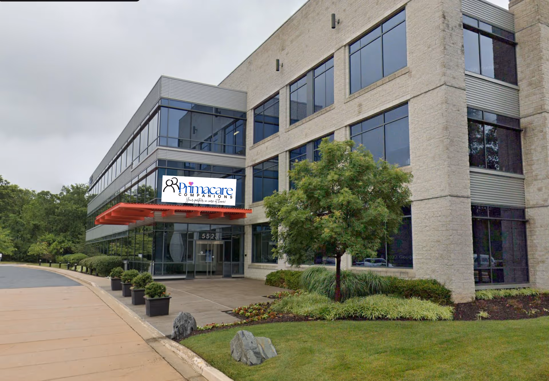 Exterior view of a modern building with a Primacare Companions sign.