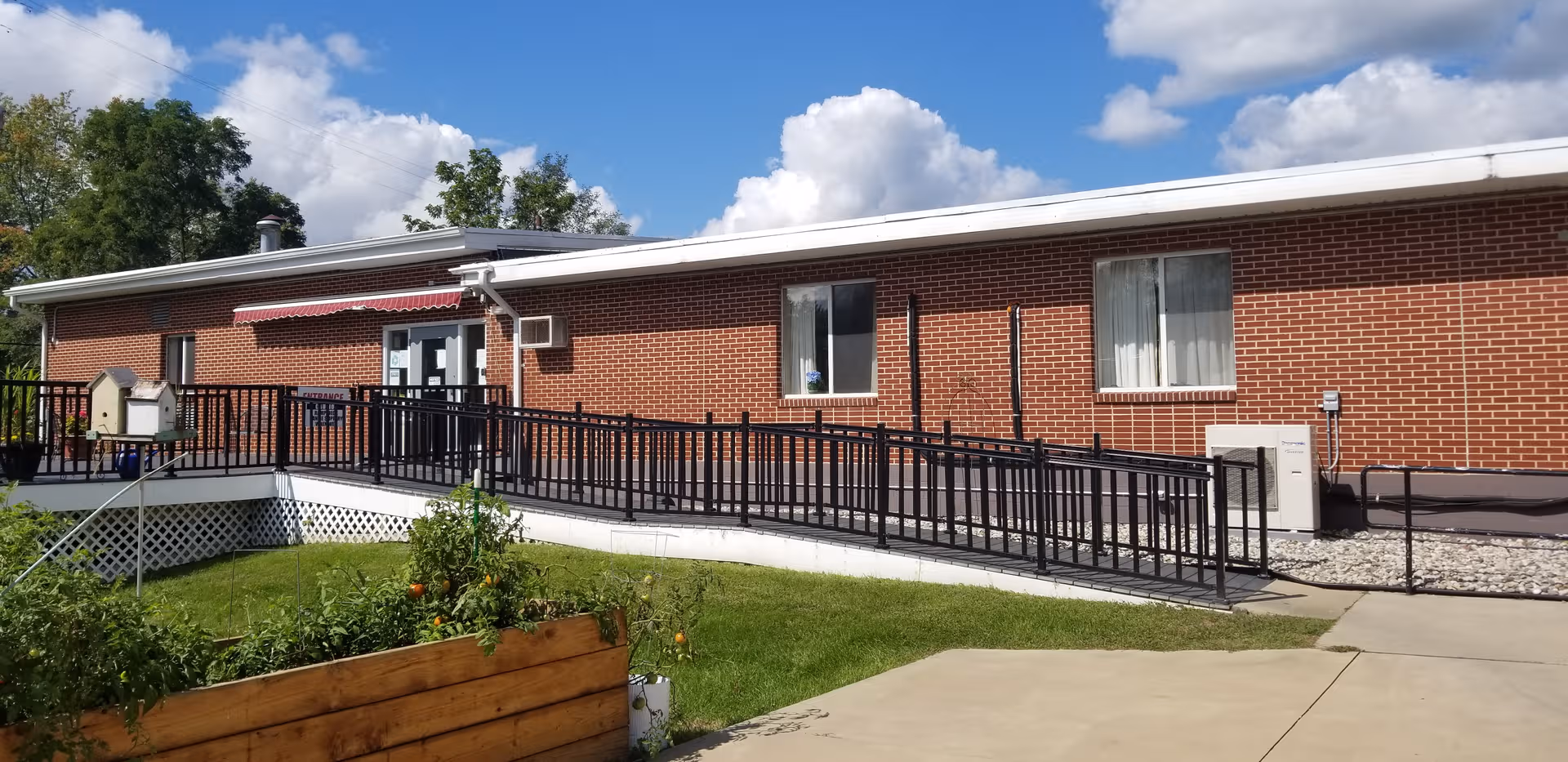 Front exterior of Argentine Care Center: brick building with an accessible ramp.
