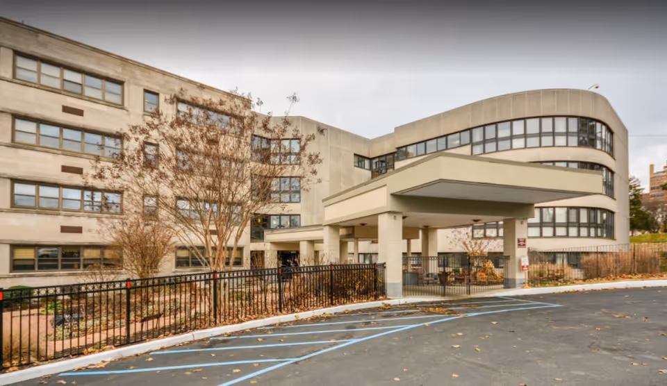 Exterior view shows the St. Francis Center for Rehabilitation and Healthcare entrance with a canopy.