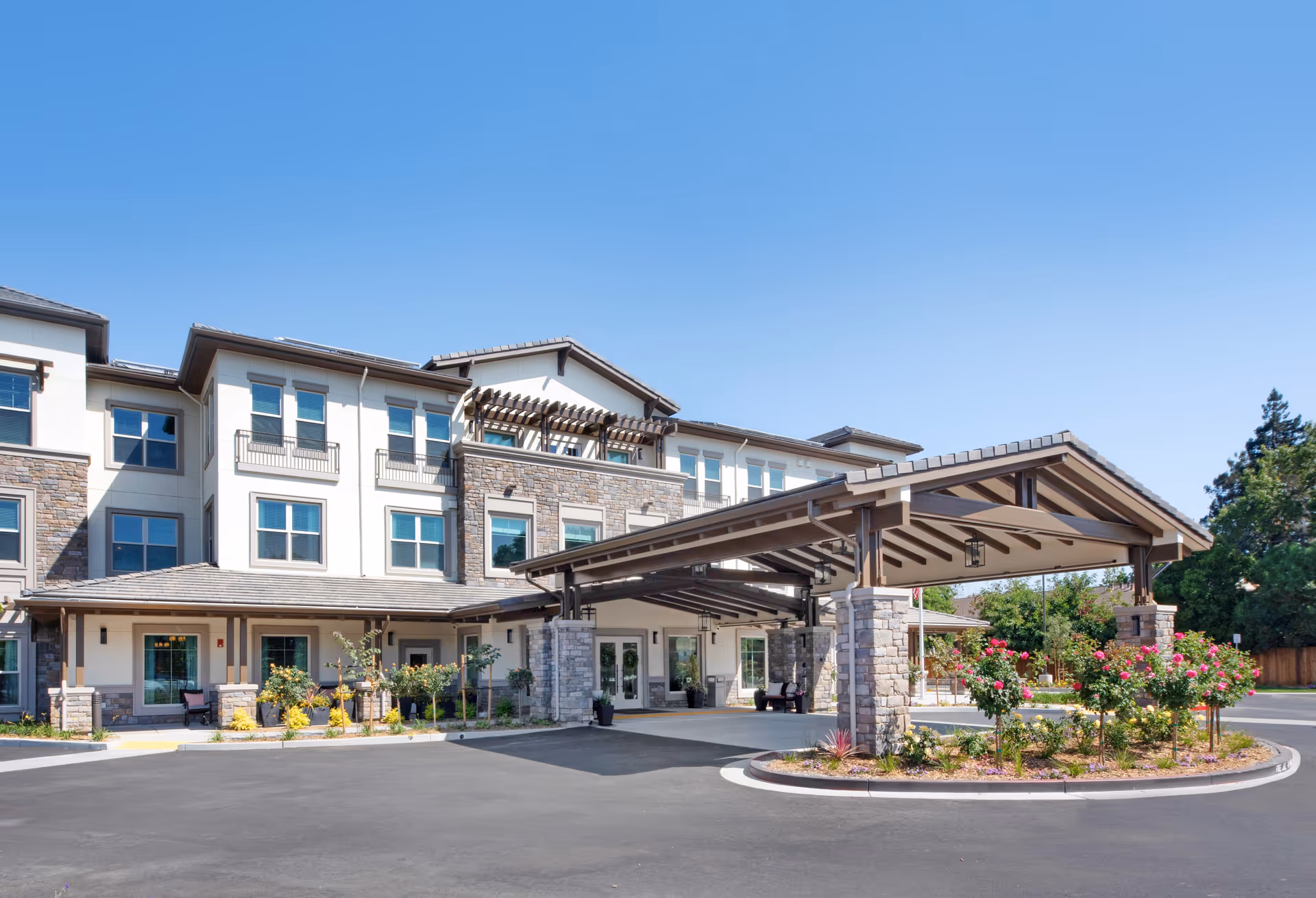 Sunrise of Cupertino facility exterior with covered entrance and landscaped surroundings.