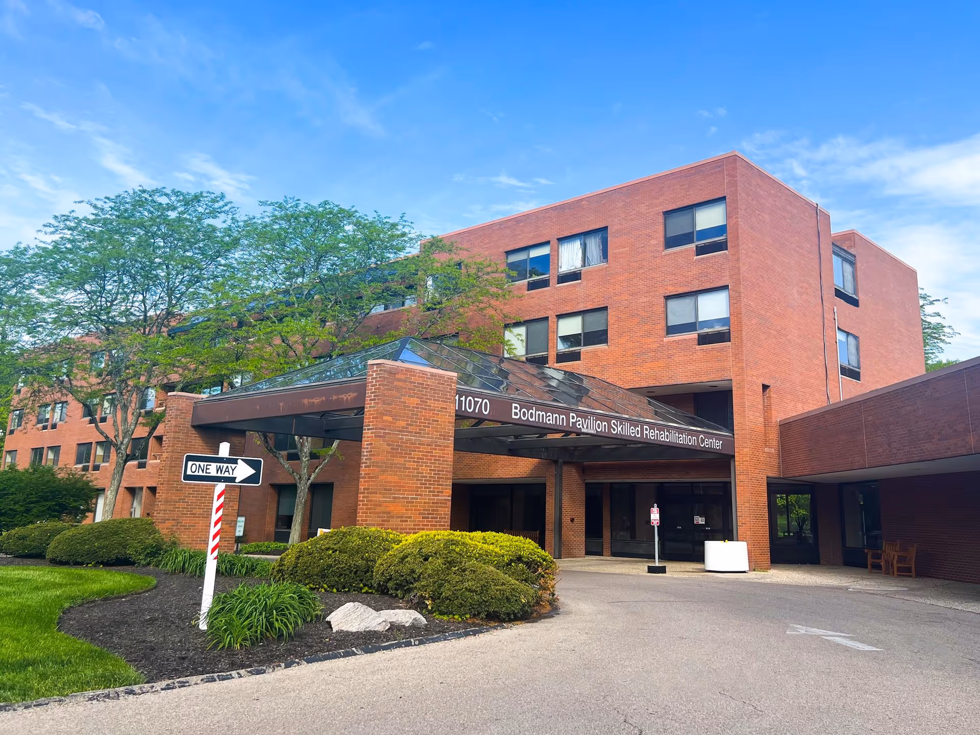Exterior view of Bodmann Pavilion Skilled Rehabilitation Center with brick facade and entrance canopy.